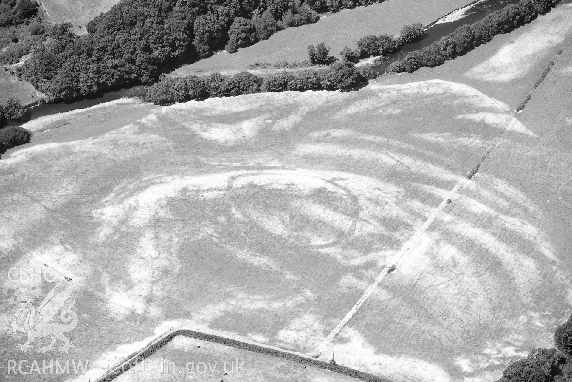 RCAHMW black and white oblique aerial photograph of Allt isaf defended enclosure taken on 9 July 2018 by Toby Driver