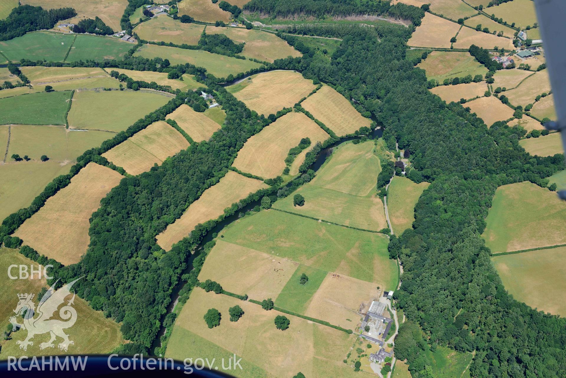 RCAHMW colour oblique aerial photograph of Llanfair Farm defended enclosure taken on 9 July 2018 by Toby Driver