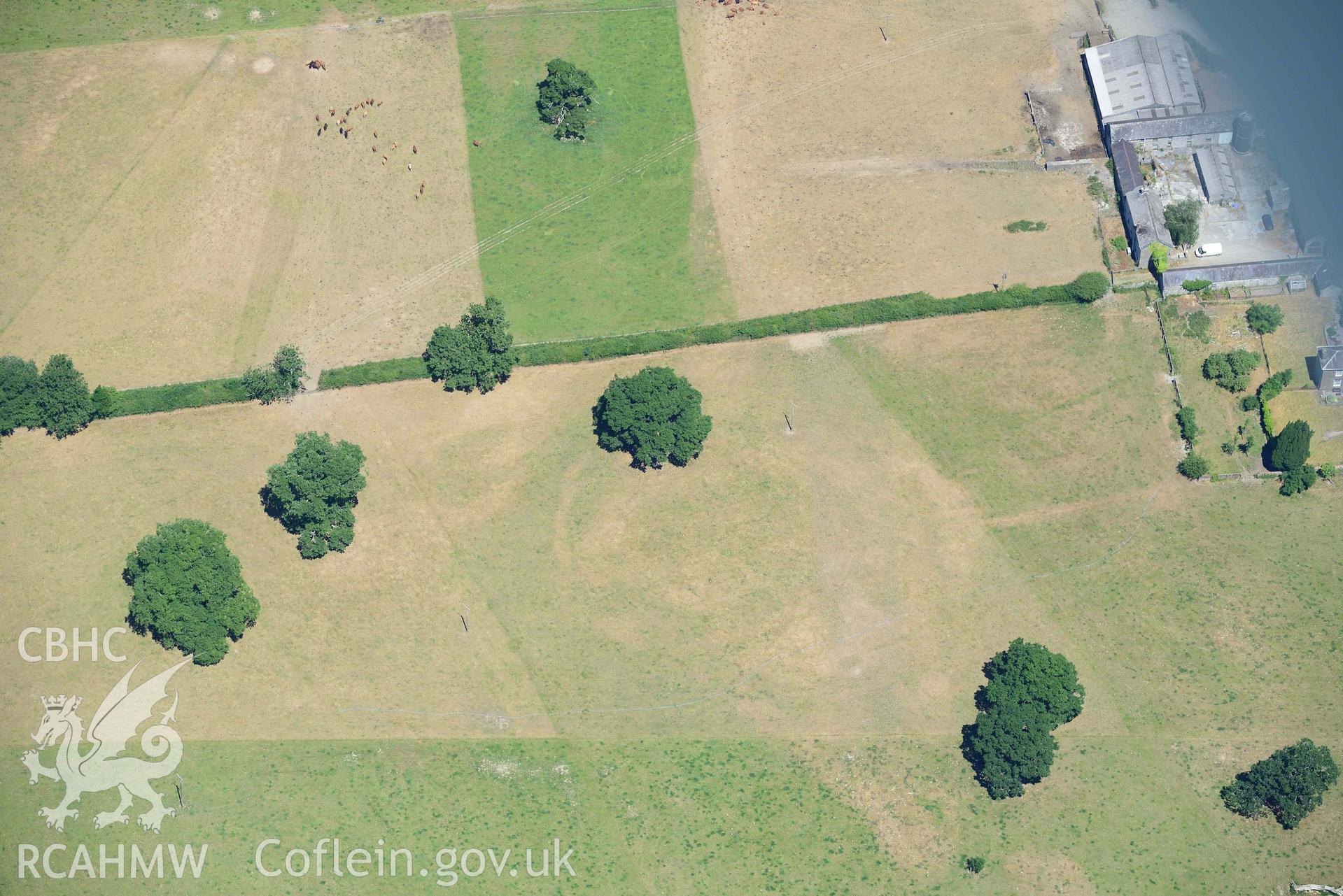 RCAHMW colour oblique aerial photograph of Llanfair Farm defended enclosure taken on 9 July 2018 by Toby Driver