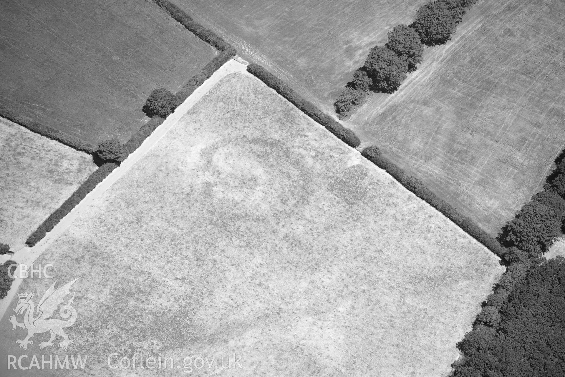 RCAHMW black and white oblique aerial photograph of Llanllwni enclosure or watchtower taken on 9 July 2018 by Toby Driver