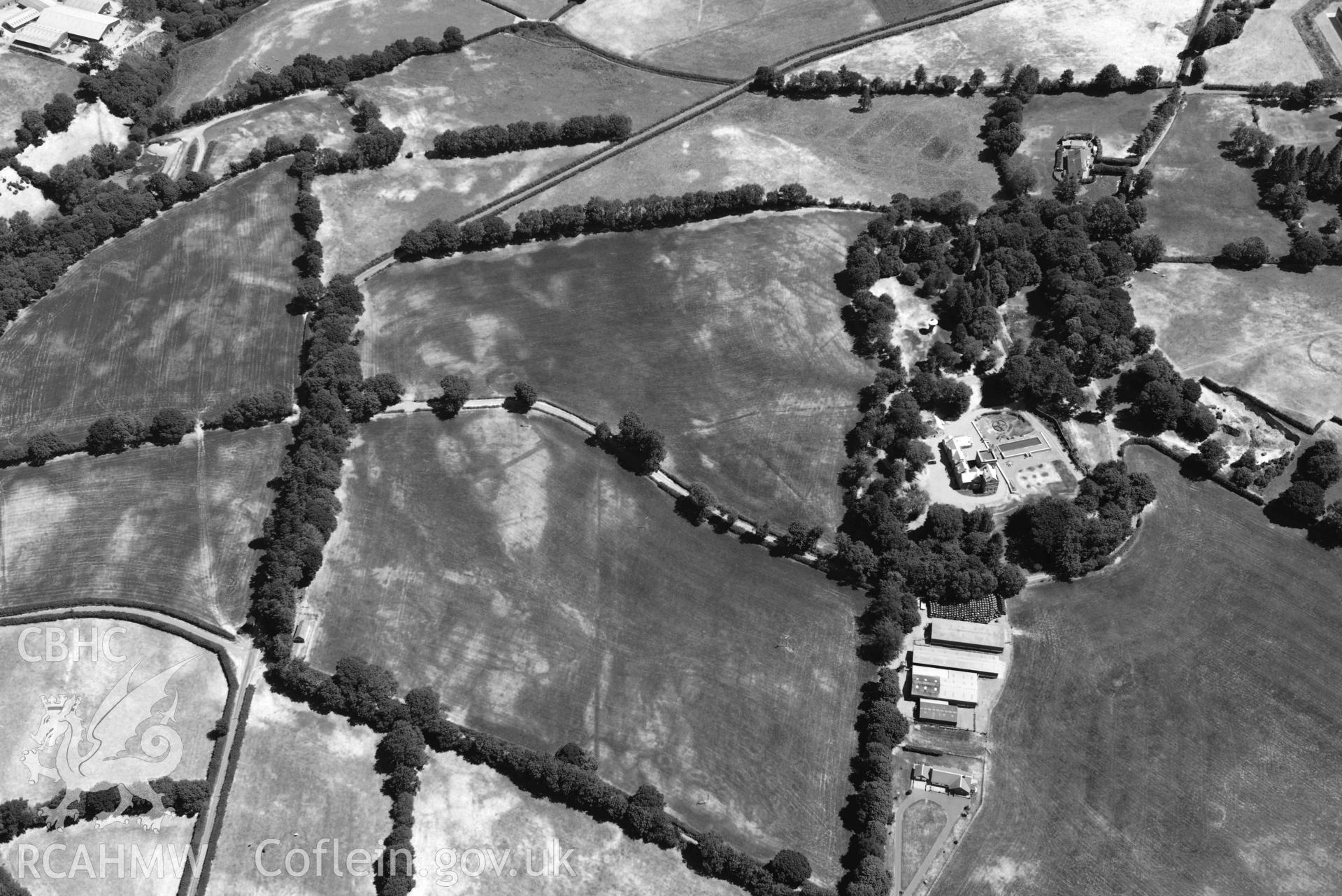 RCAHMW black and white oblique aerial photograph of Maes-y-Crugiau Manor; Maesycrugiau taken on 9 July 2018 by Toby Driver