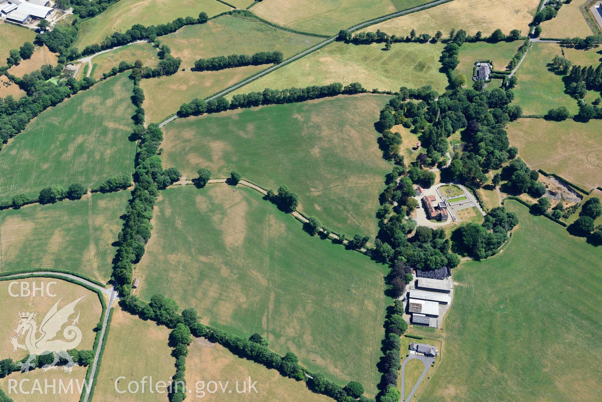 RCAHMW colour oblique aerial photograph of Maes-y-Crugiau Manor; Maesycrugiau taken on 9 July 2018 by Toby Driver