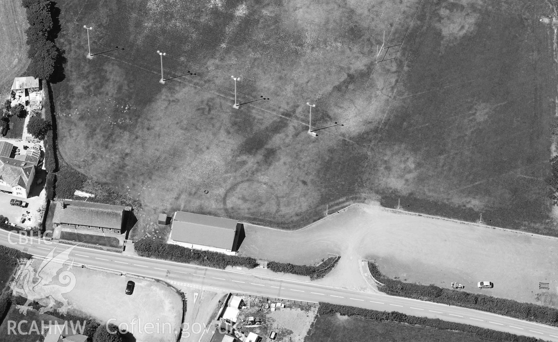 RCAHMW black and whitre oblique aerial photograph of Cwmann rugby club ring ditches taken on 9 July 2018 by Toby Driver