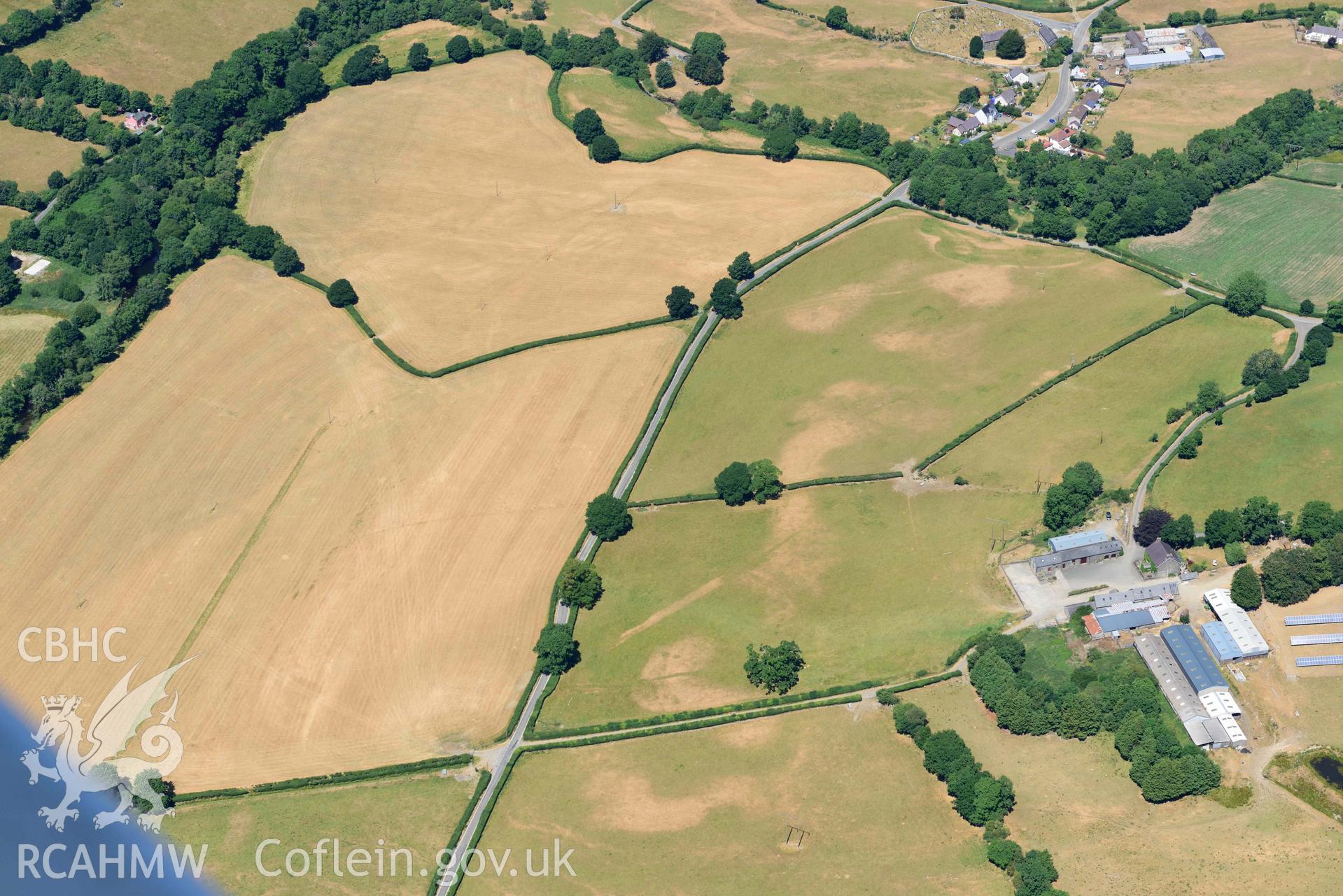 RCAHMW colour oblique aerial photograph of Pentre Llanfair Roman road and roadside settlement taken on 9 July 2018 by Toby Driver