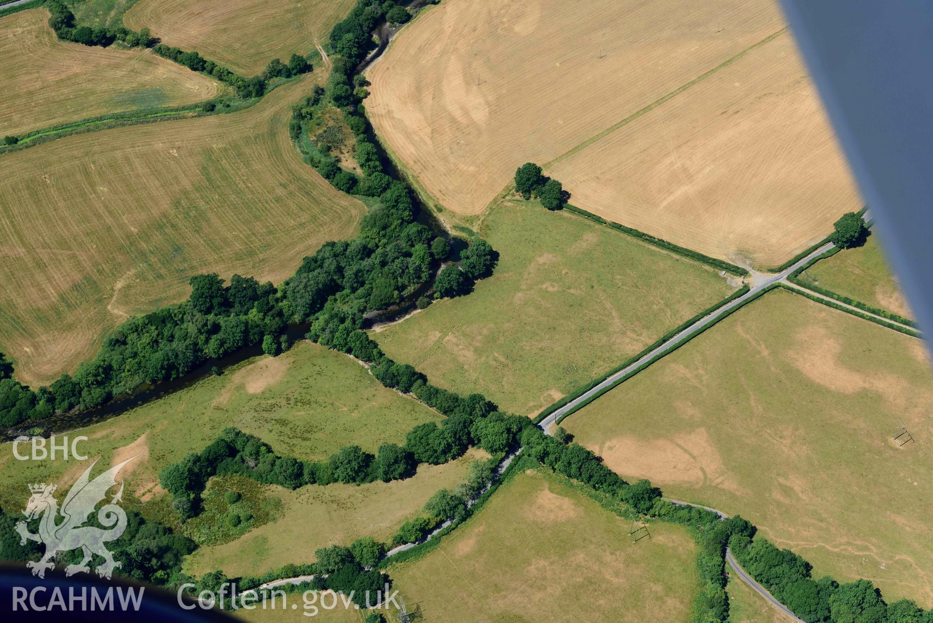 RCAHMW colour oblique aerial photograph of Pentre cropmark enclosure taken on 9 July 2018 by Toby Driver