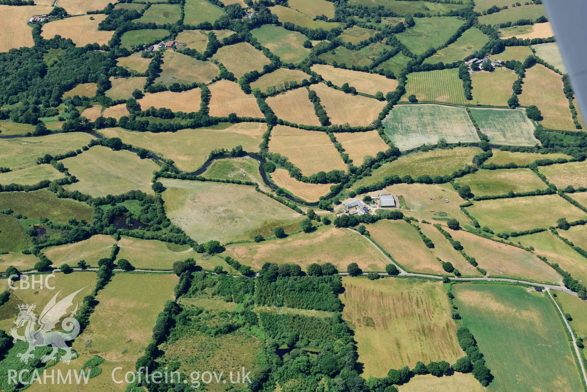 RCAHMW colour oblique aerial photograph of Pen-ddol Roman Road quarry pits ( SN 636529) taken on 9 July 2018 by Toby Driver