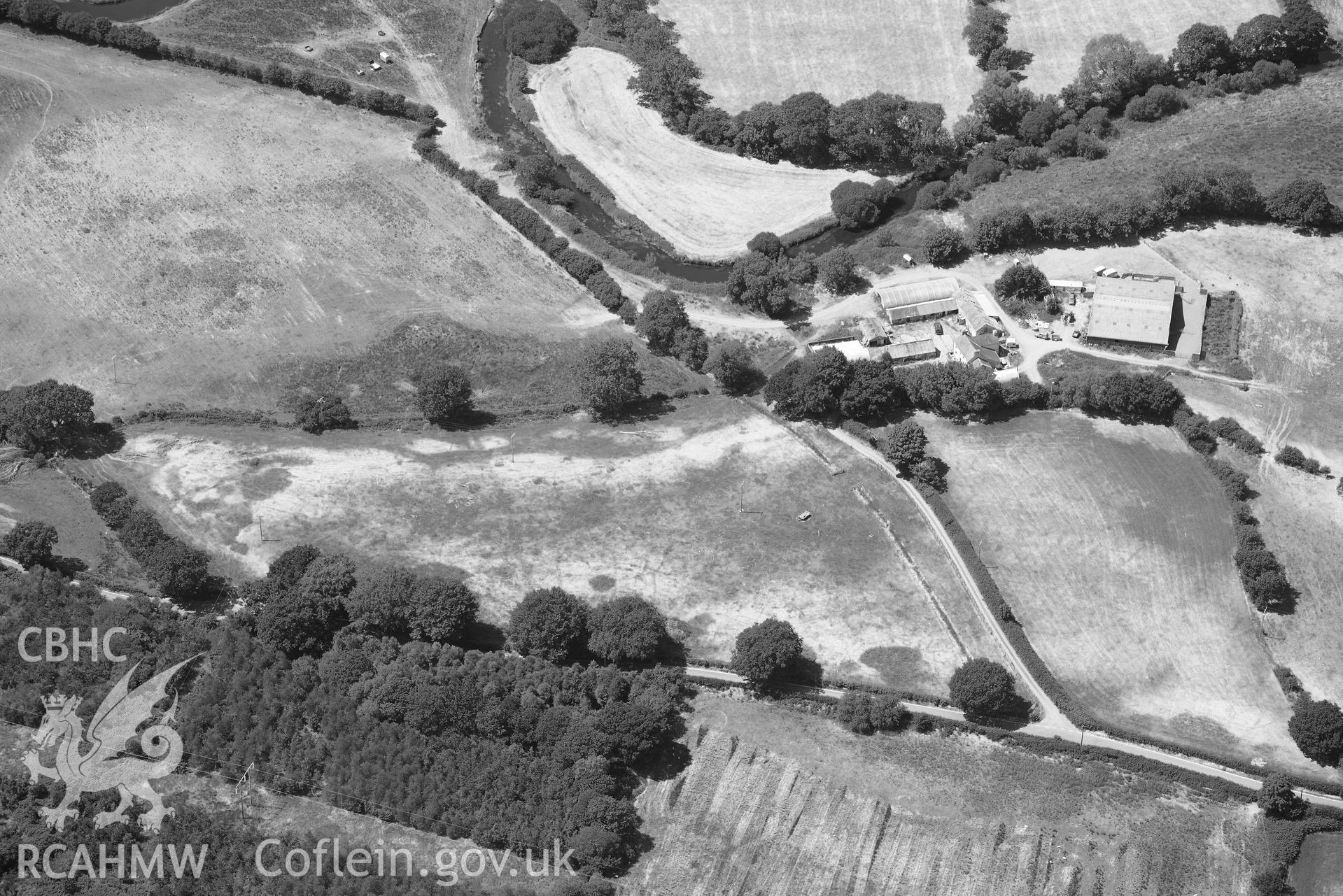 RCAHMW black and white oblique aerial photograph of Pen-ddol Roman Road quarry pits ( SN 636529) taken on 9 July 2018 by Toby Driver