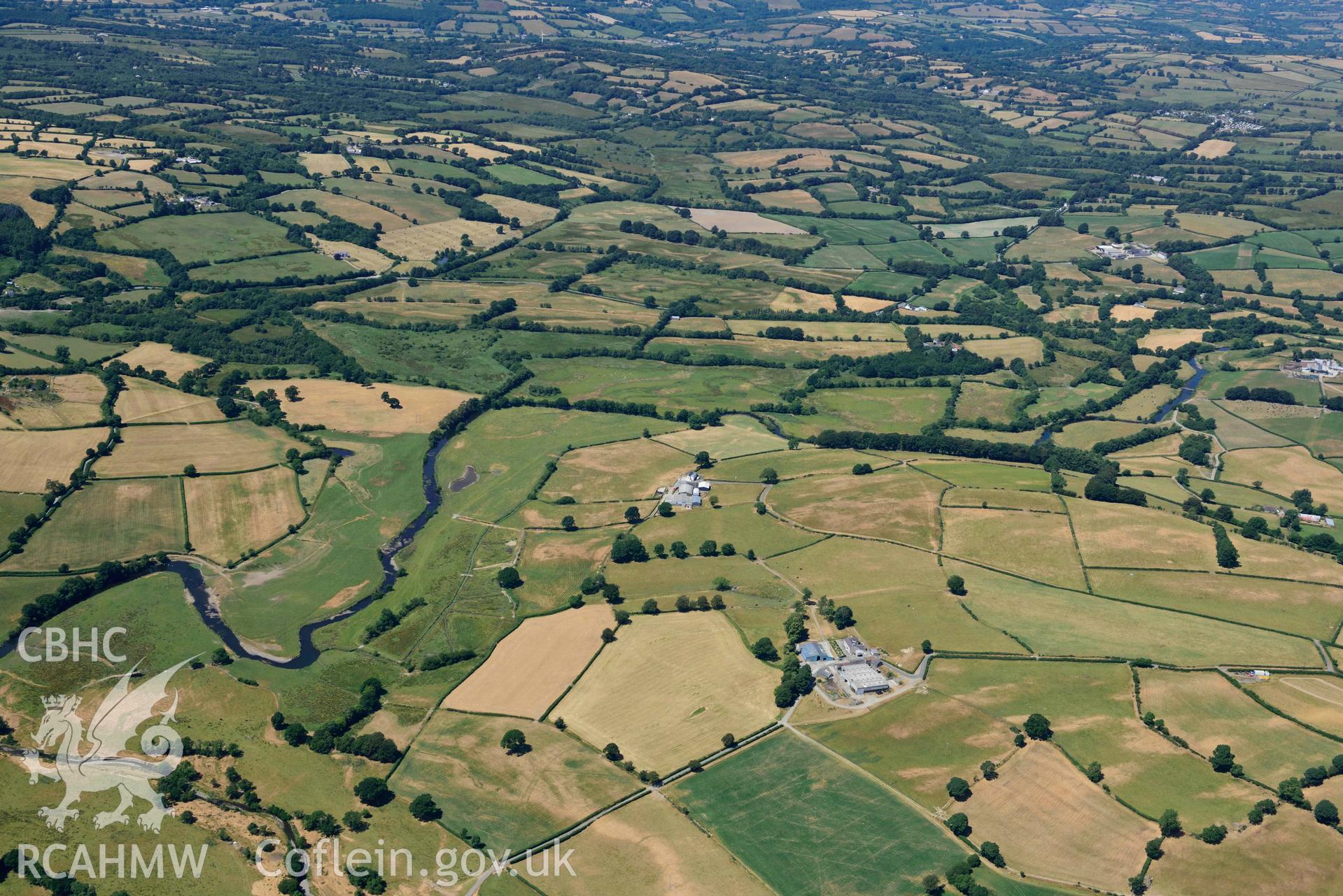 RCAHMW colour oblique aerial photograph of Roman road approaching Llanio Roman fort taken on 9 July 2018 by Toby Driver