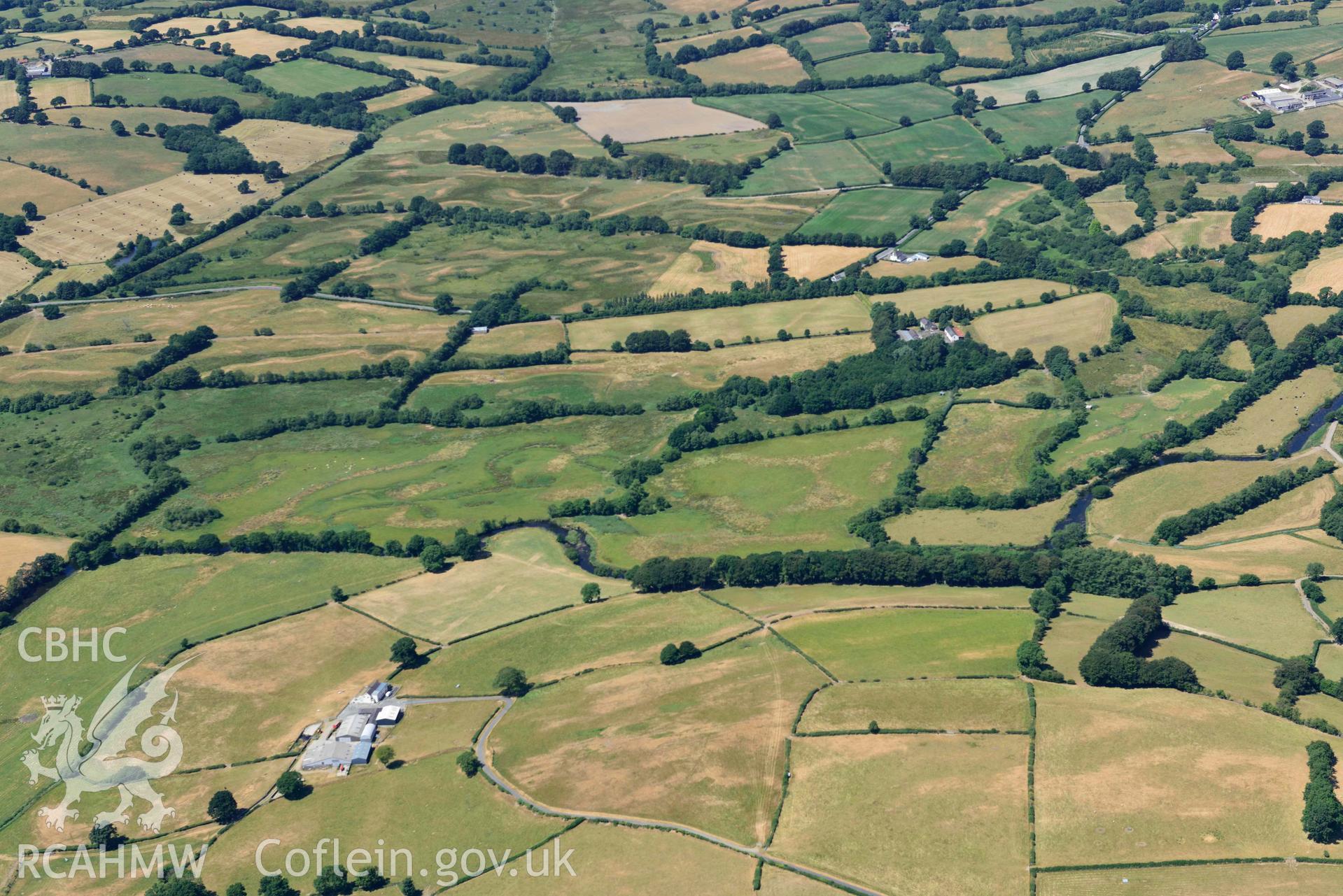 RCAHMW colour oblique aerial photograph of Roman road approaching Llanio Roman fort taken on 9 July 2018 by Toby Driver