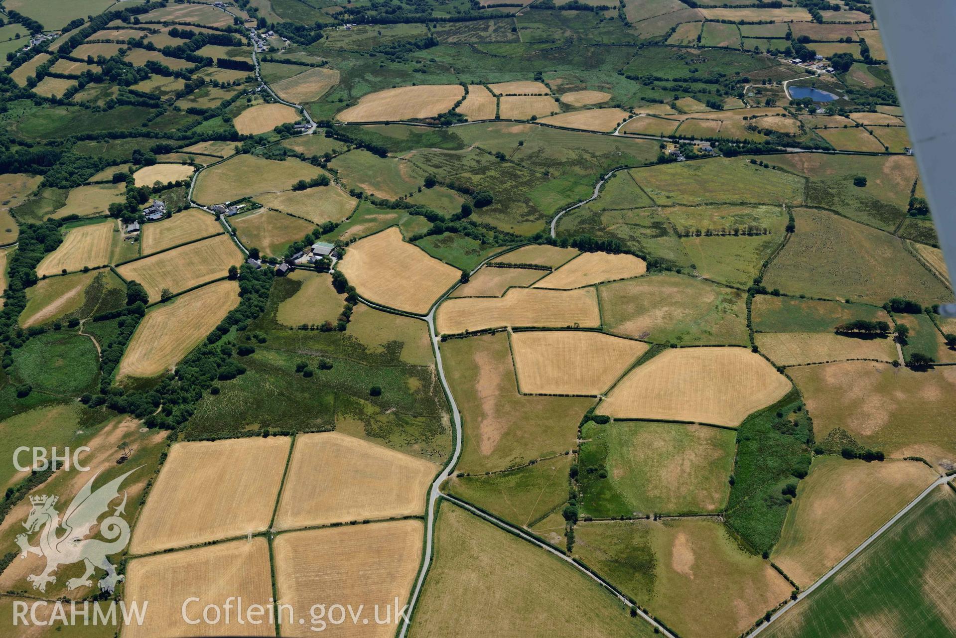 RCAHMW colour oblique aerial photograph of Ty Hen landscape from the North taken on 9 July 2018 by Toby Driver