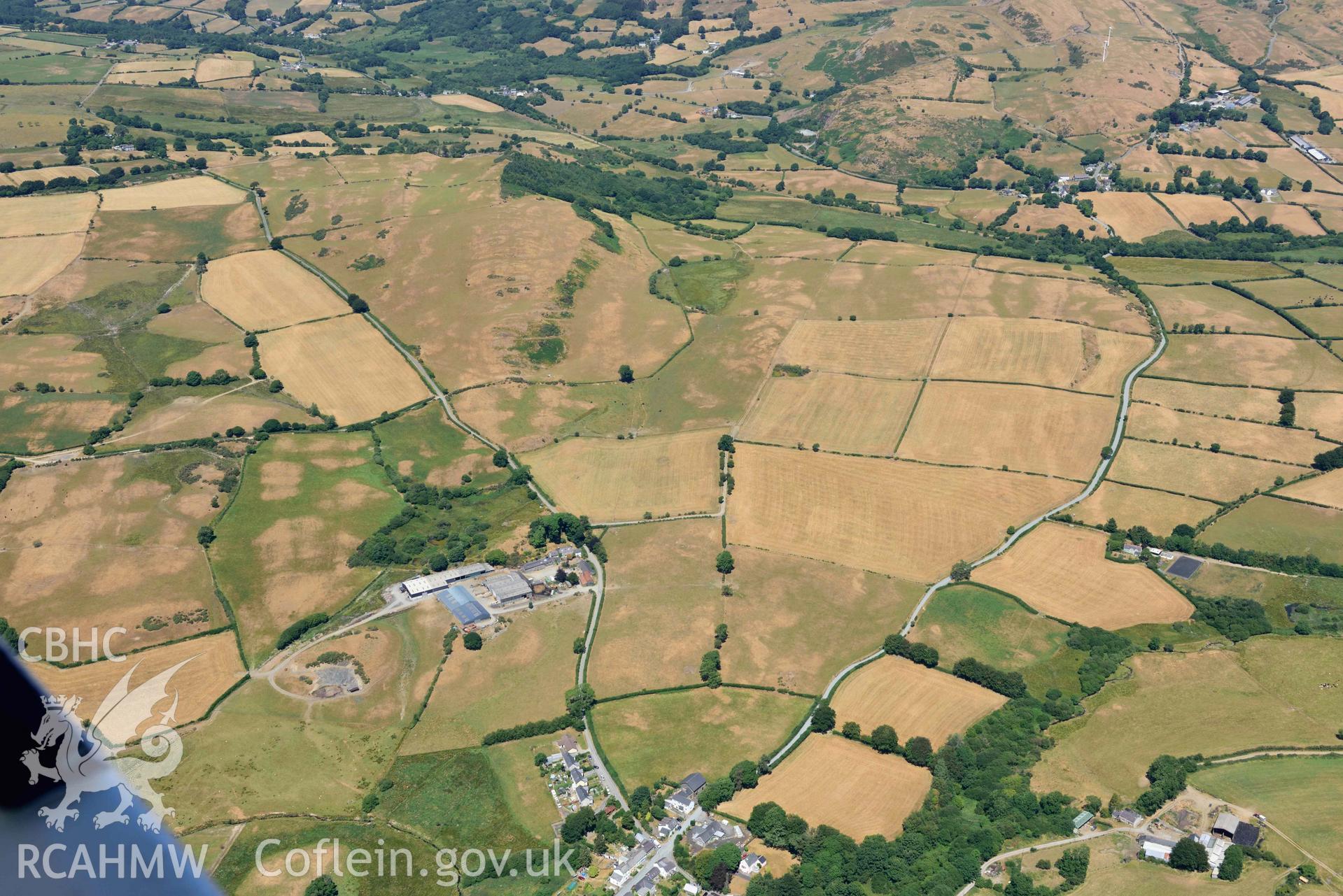 RCAHMW colour oblique aerial photograph of  Swyddffynnon village taken on 9 July 2018 by Toby Driver