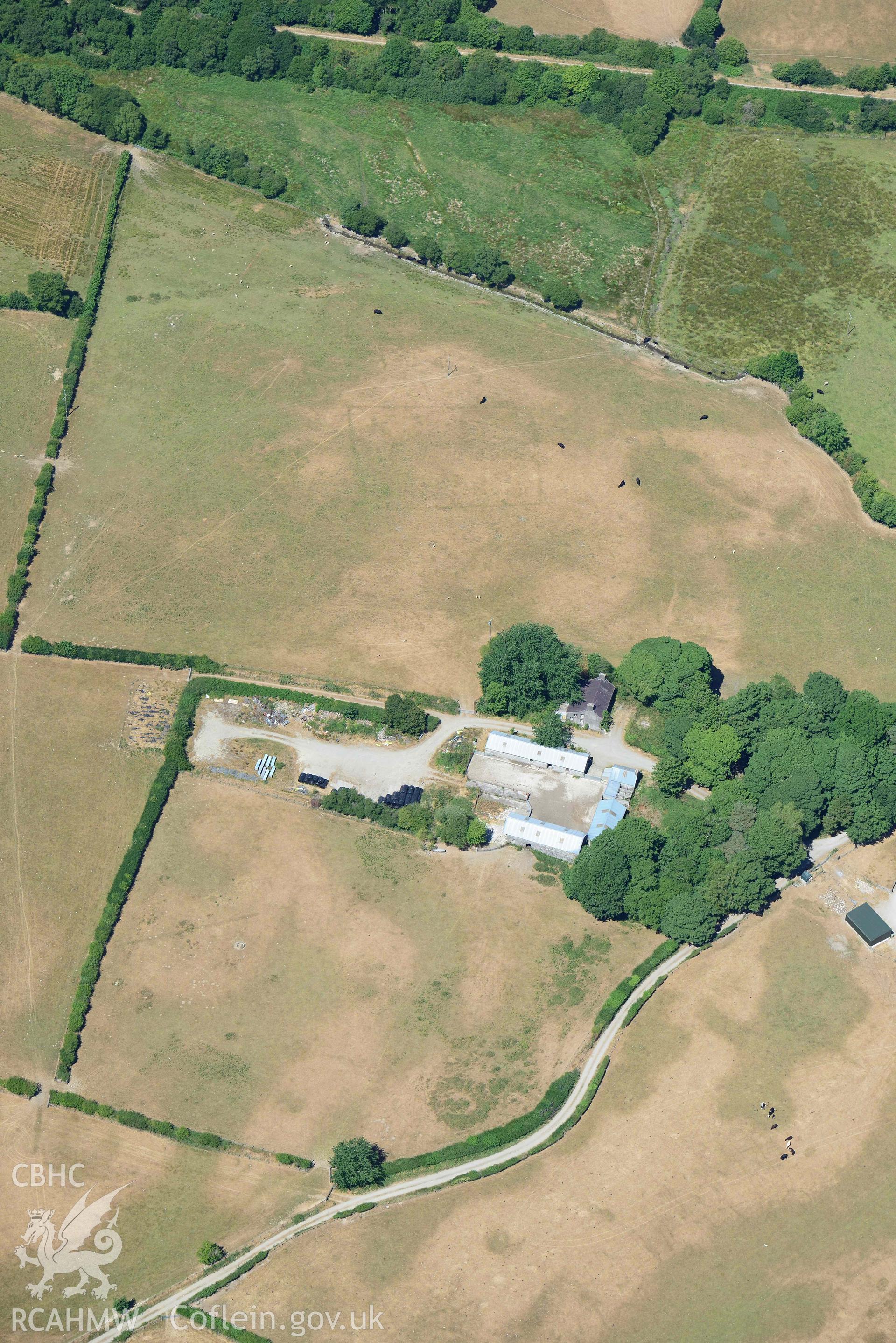 RCAHMW colour oblique aerial photograph of Maebandlog rectangular enclosure taken on 9 July 2018 by Toby Driver