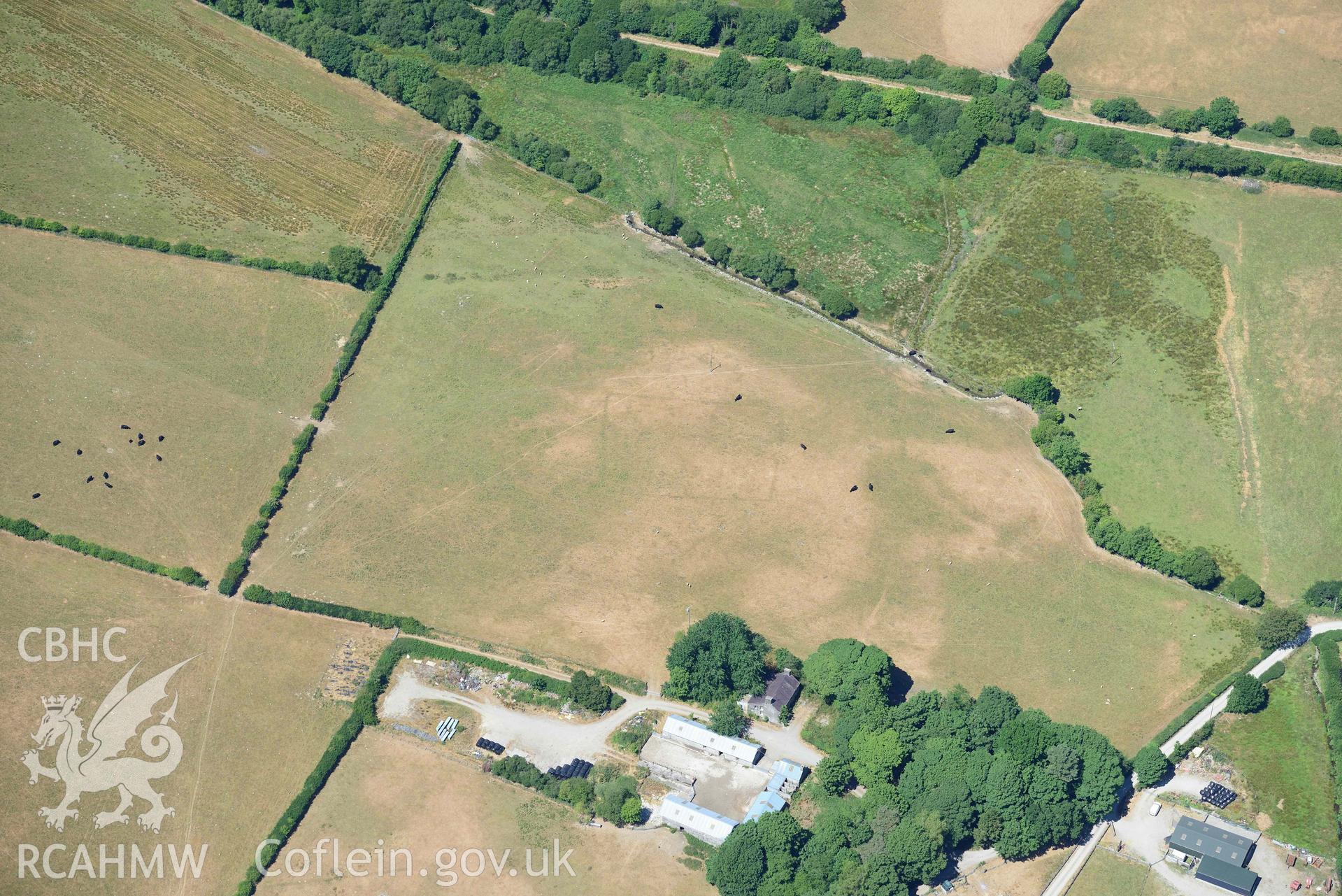 RCAHMW colour oblique aerial photograph of Maebandlog rectangular enclosure taken on 9 July 2018 by Toby Driver