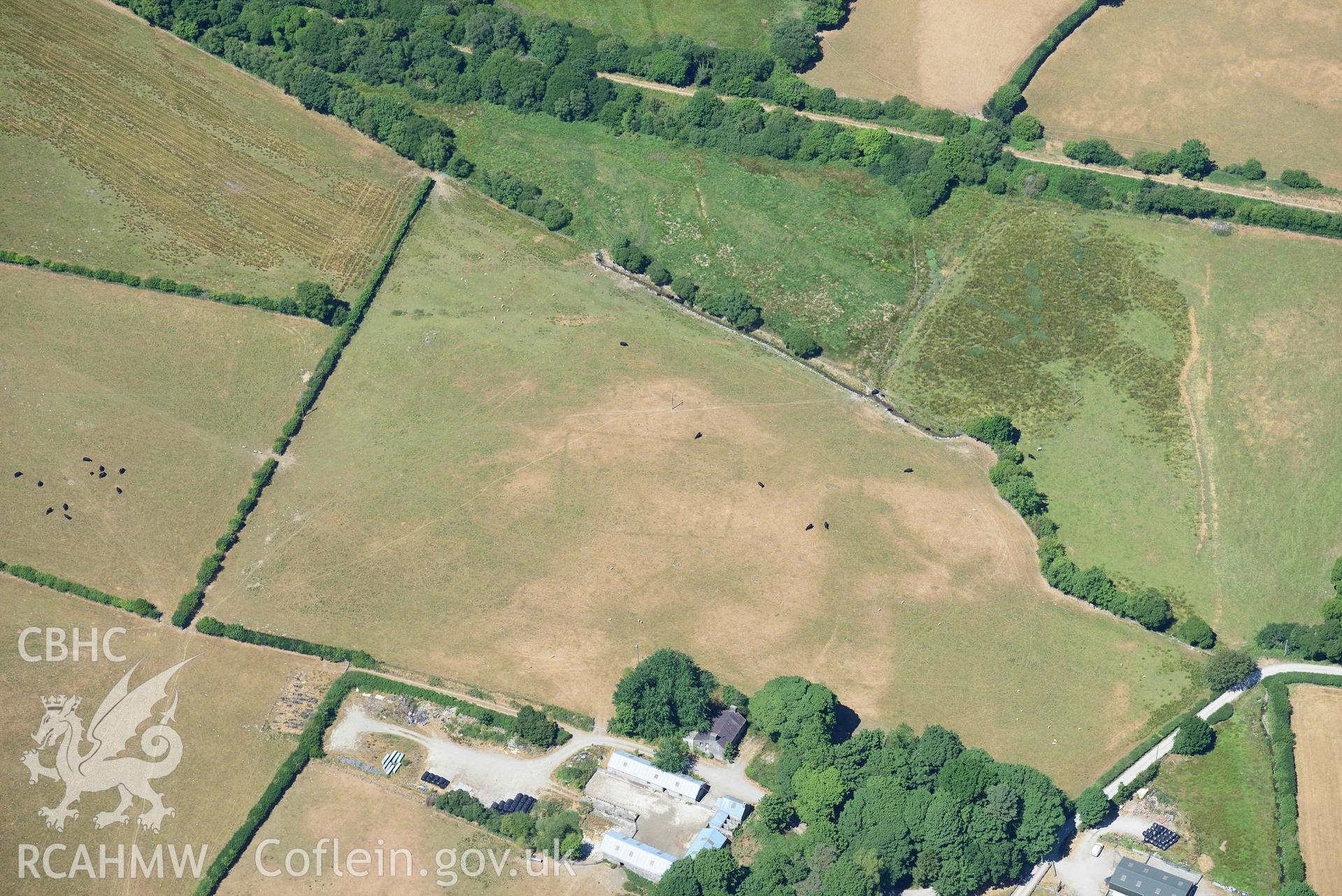 RCAHMW black and white oblique aerial photograph of Maebandlog rectangular enclosure taken on 9 July 2018 by Toby Driver