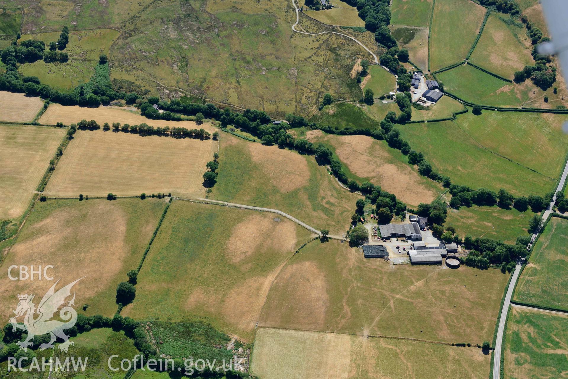 RCAHMW colour oblique aerial photograph of Old Abbey Farm 2 and Site of Hen Fynachlog taken on 9 July 2018 by Toby Driver