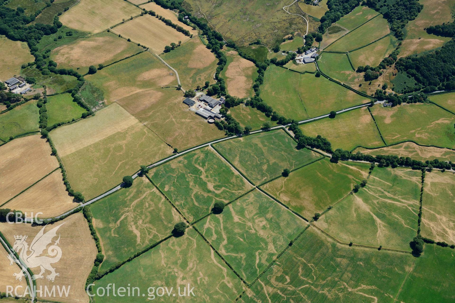 RCAHMW colour oblique aerial photograph of Old Abbey Farm 2 and Site of Hen Fynachlog taken on 9 July 2018 by Toby Driver