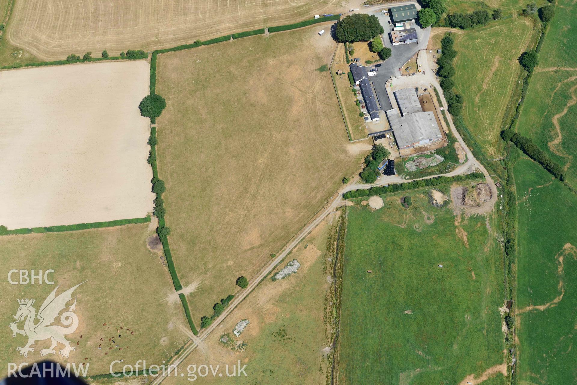 RCAHMW colour oblique aerial photograph of Pont Fflur Roman enclosure taken on 9 July 2018 by Toby Driver