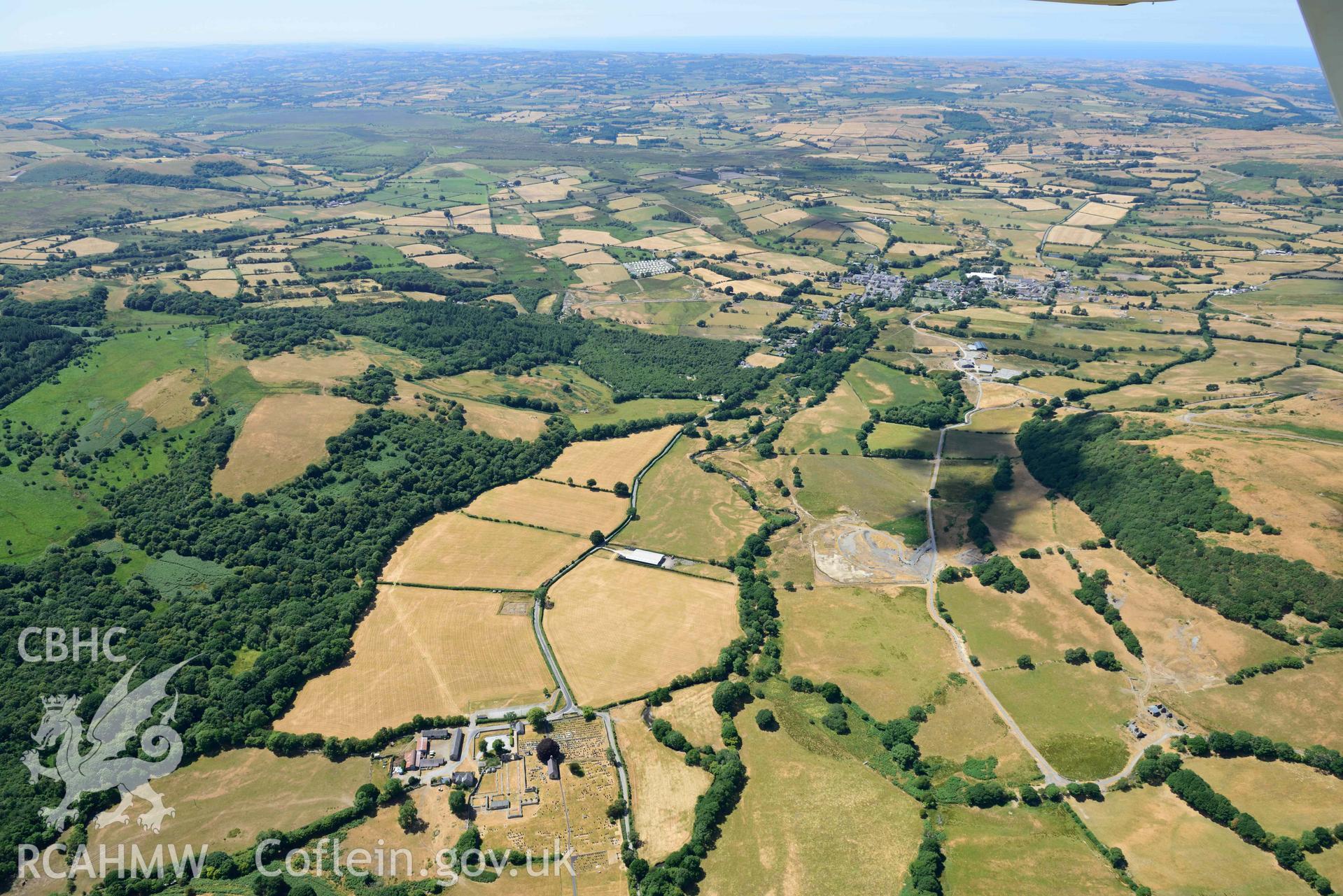 RCAHMW colour oblique aerial photograph of  Pontrhydfendigaid village and Strata Florida Abbey taken on 9 July 2018 by Toby Driver