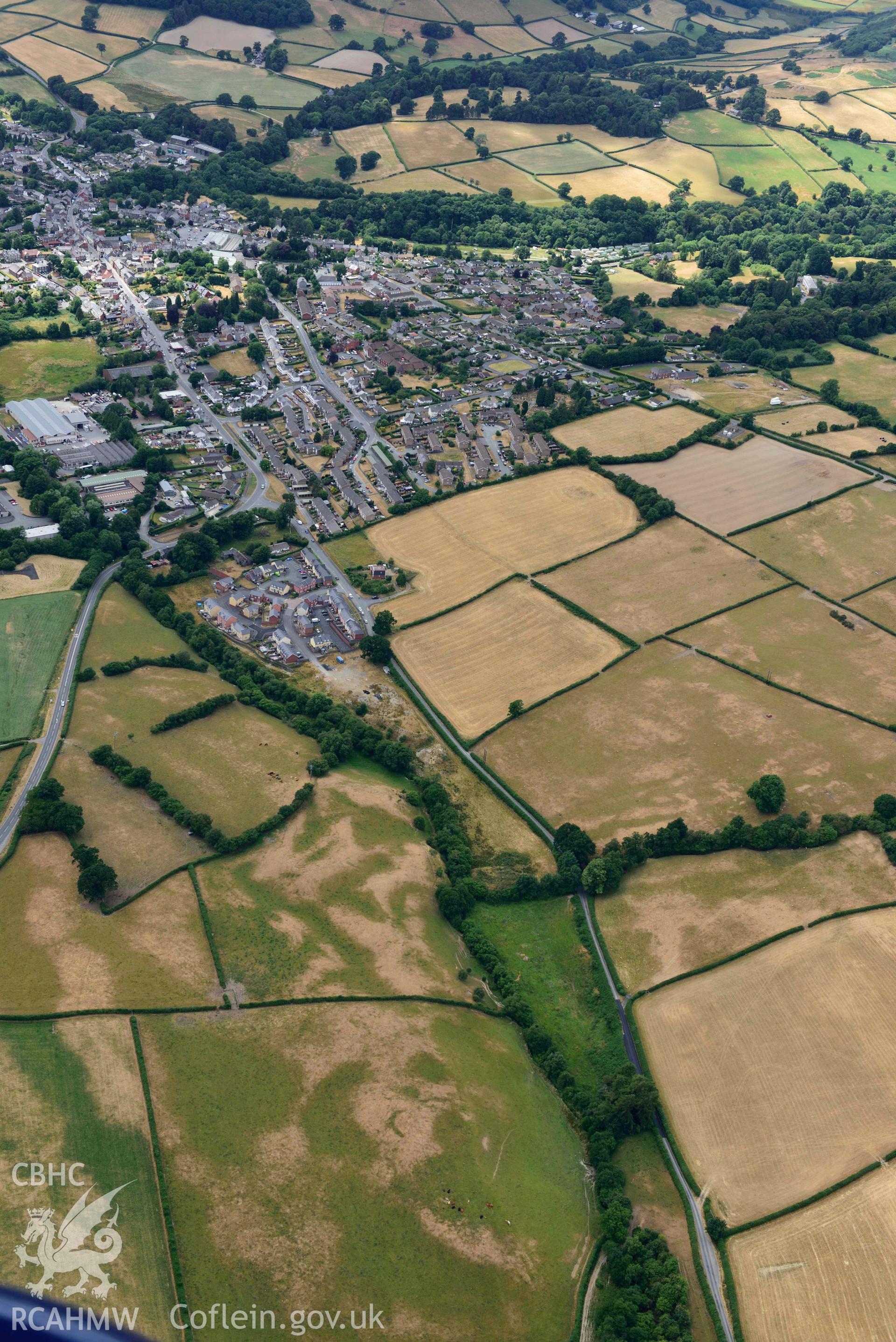 RCAHMW colour oblique aerial photograph of Rhayader Town and Rhyd y Hir Barrow taken on 9 July 2018 by Toby Driver