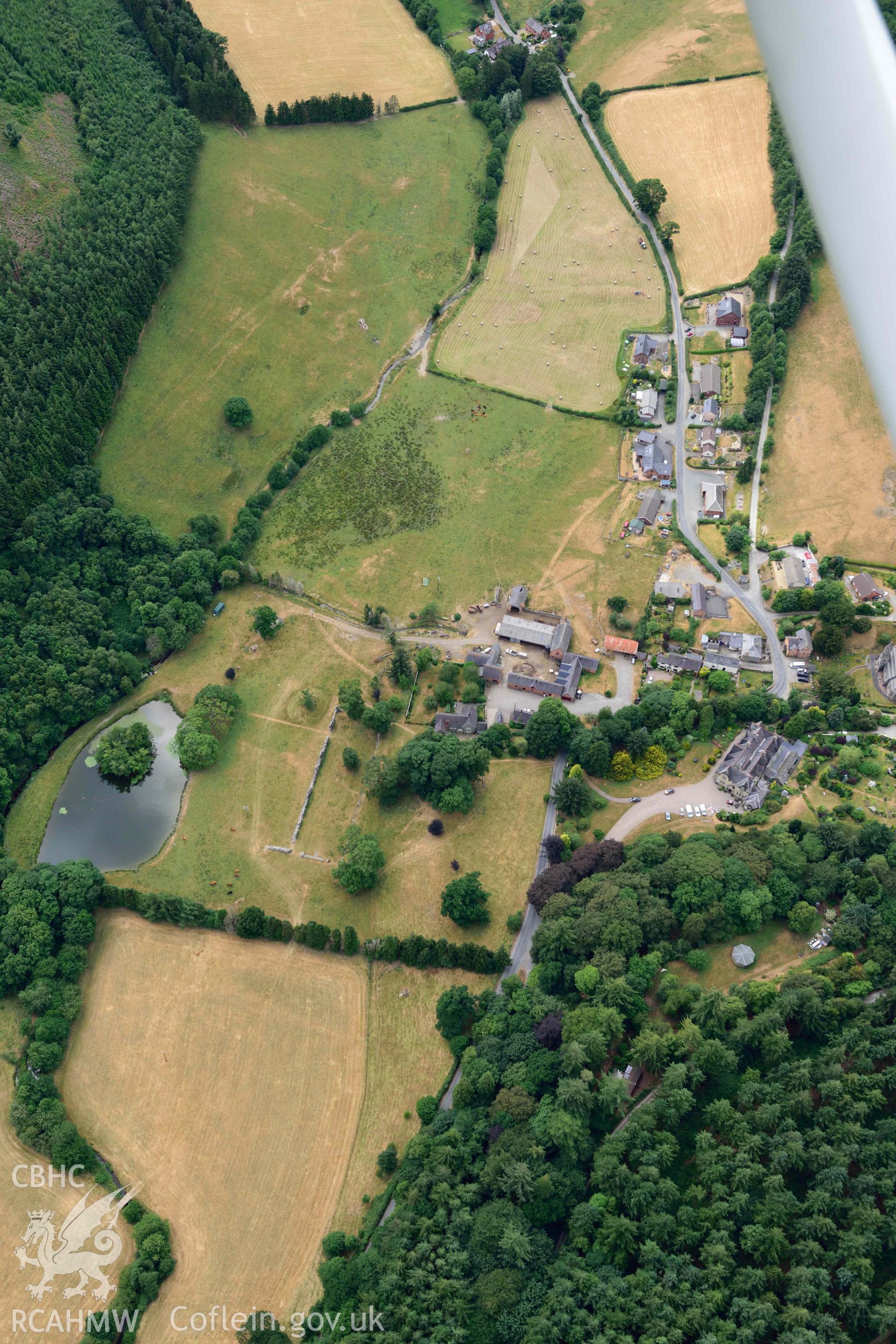 RCAHMW colour oblique aerial photograph of Abbey Cwmhir burial ground taken on 9 July 2018 by Toby Driver