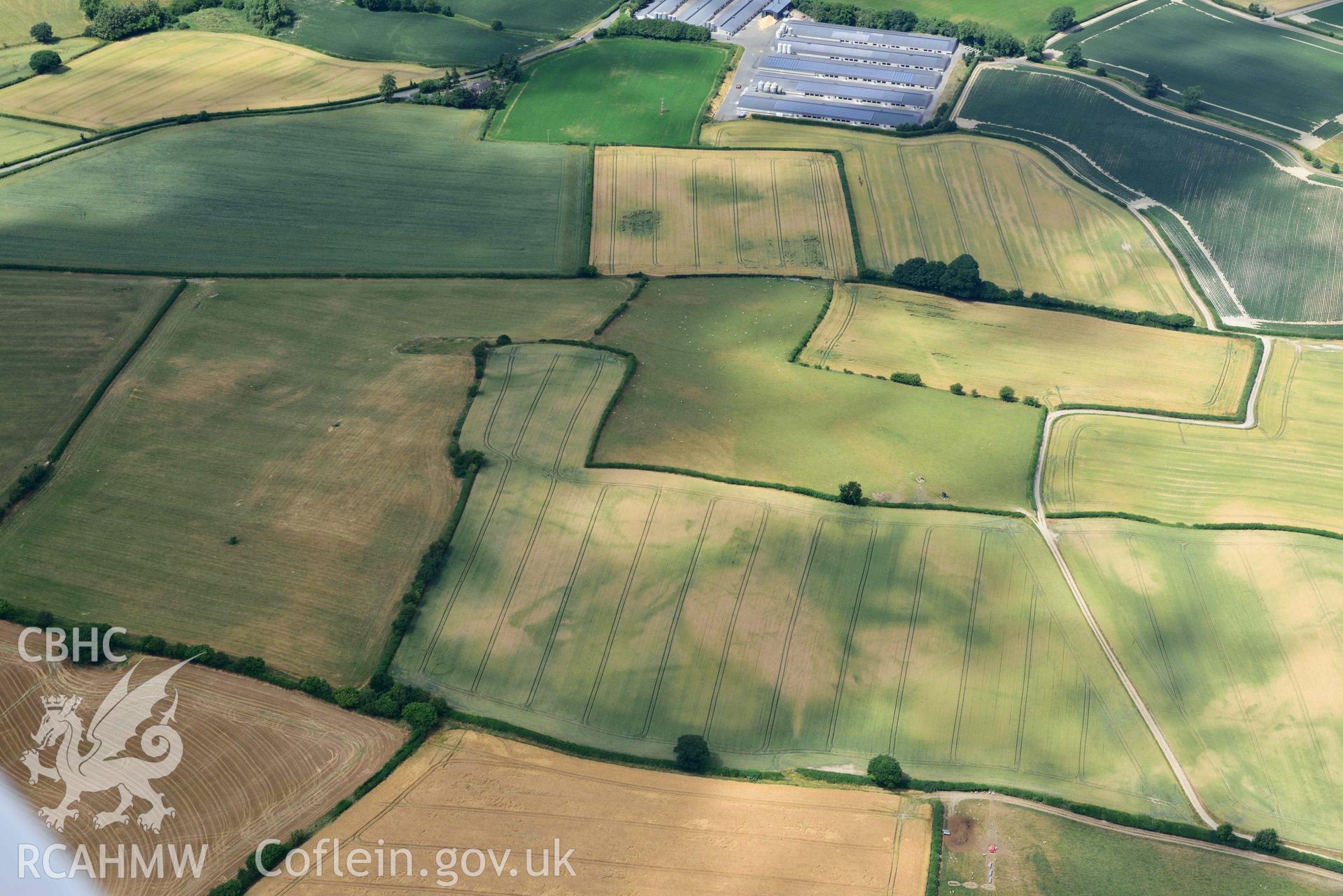 RCAHMW colour oblique aerial photograph of Womaston causewayed enclosure taken on 9 July 2018 by Toby Driver