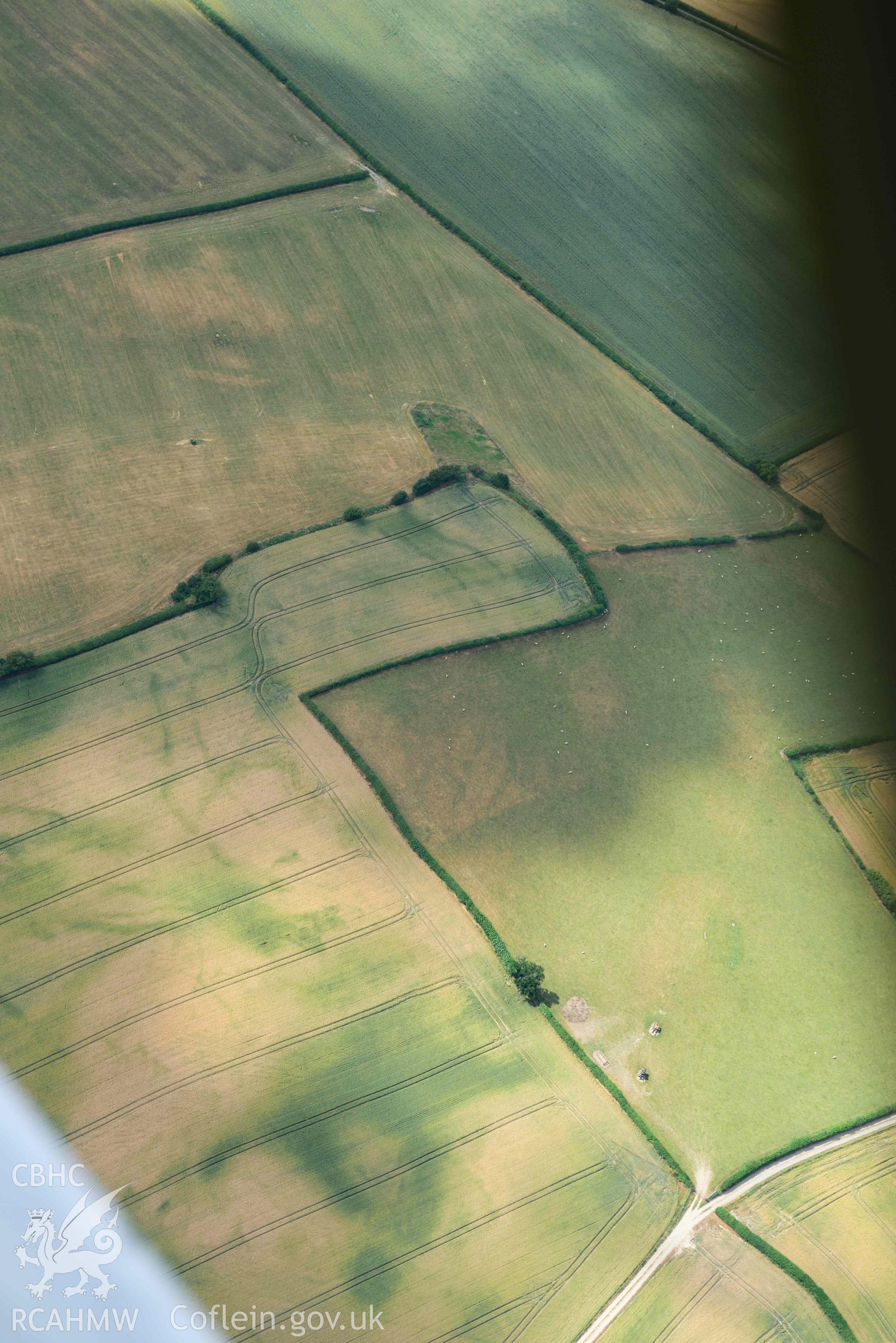 RCAHMW colour oblique aerial photograph of Womaston causewayed enclosure taken on 9 July 2018 by Toby Driver