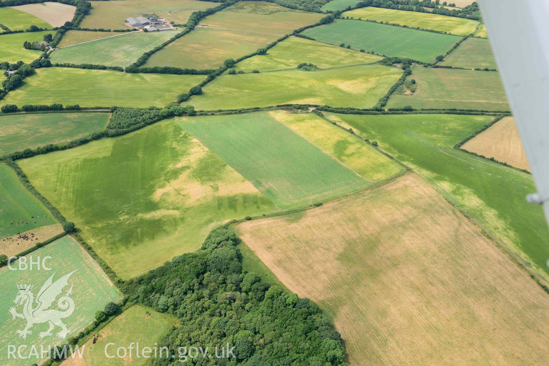 RCAHMW colour oblique aerial photograph of Round Barrows, Northeast of Dryslwyn, Causewayed enclosure, Dryslwyn taken on 11 July 2018 by Toby Driver