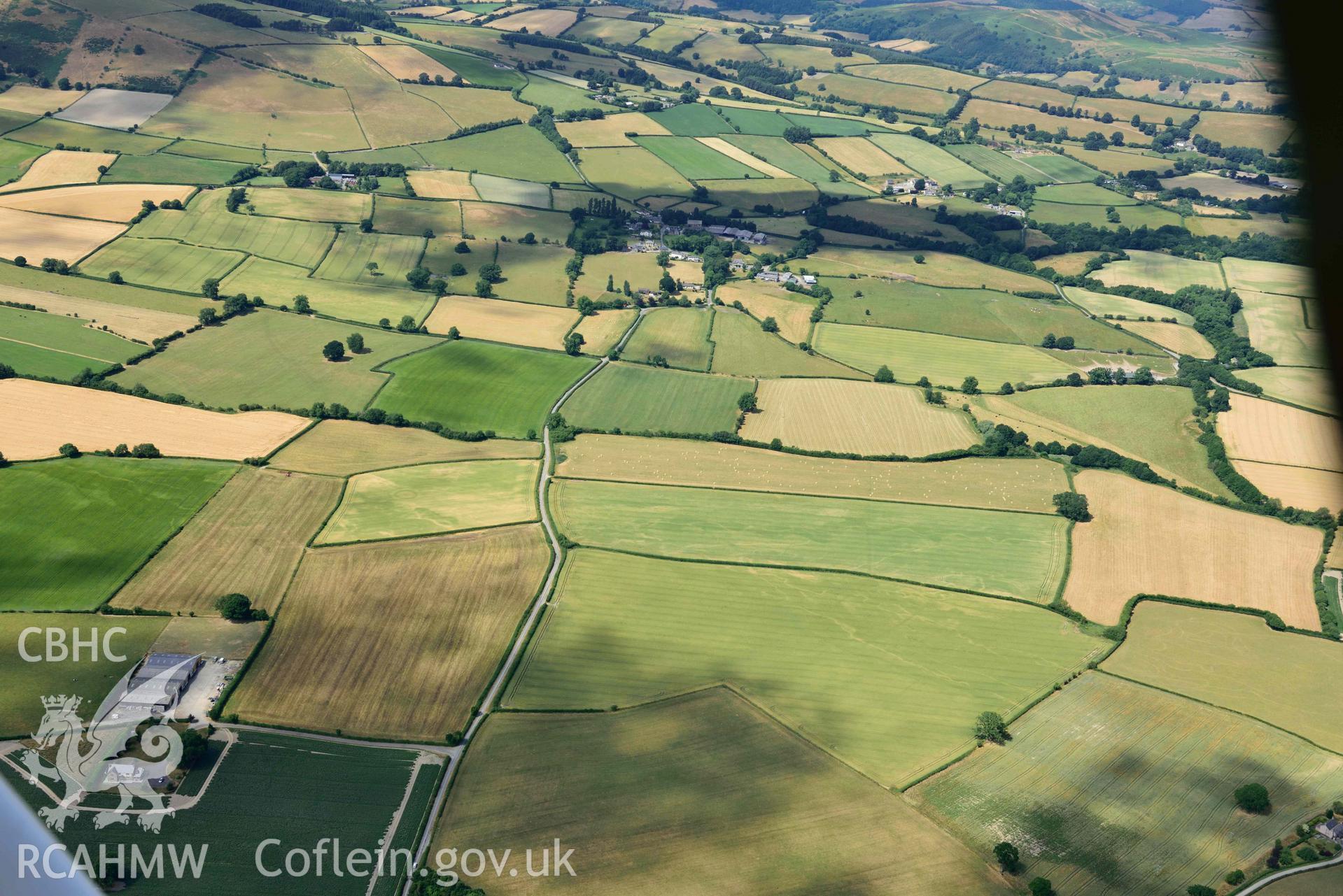 RCAHMW colour oblique aerial photograph of Rough close ring ditch taken on 9 July 2018 by Toby Driver