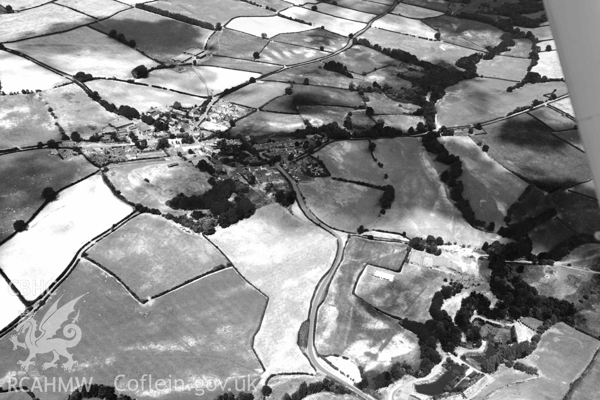 RCAHMW black and white oblique aerial photograph of Painscastle ring ditch taken on 9 July 2018 by Toby Driver