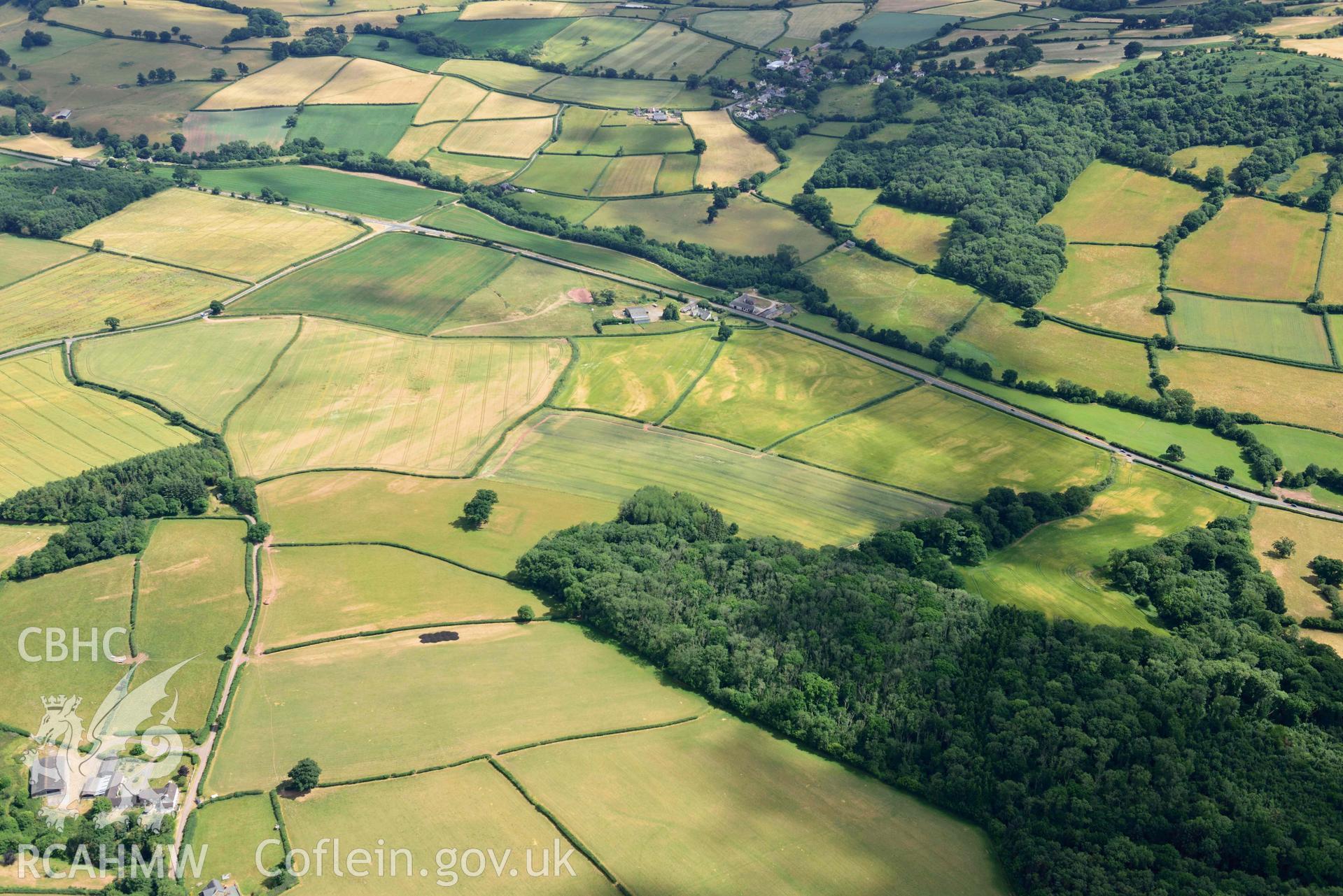 RCAHMW colour oblique aerial photograph of Pont y Bat moat taken on 9 July 2018 by Toby Driver