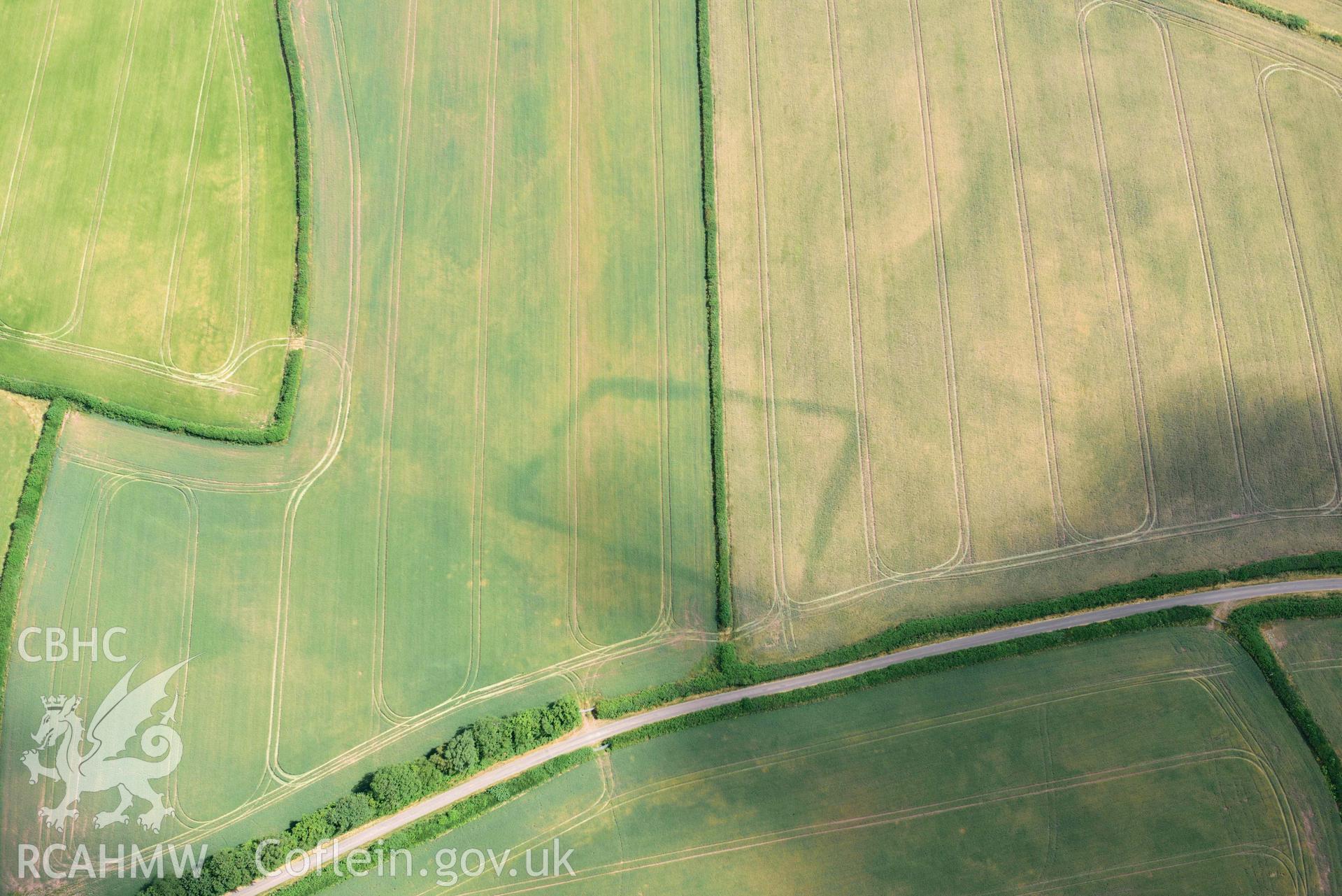 RCAHMW colour oblique aerial photograph of Court Llacca cropmark taken on 9 July 2018 by Toby Driver