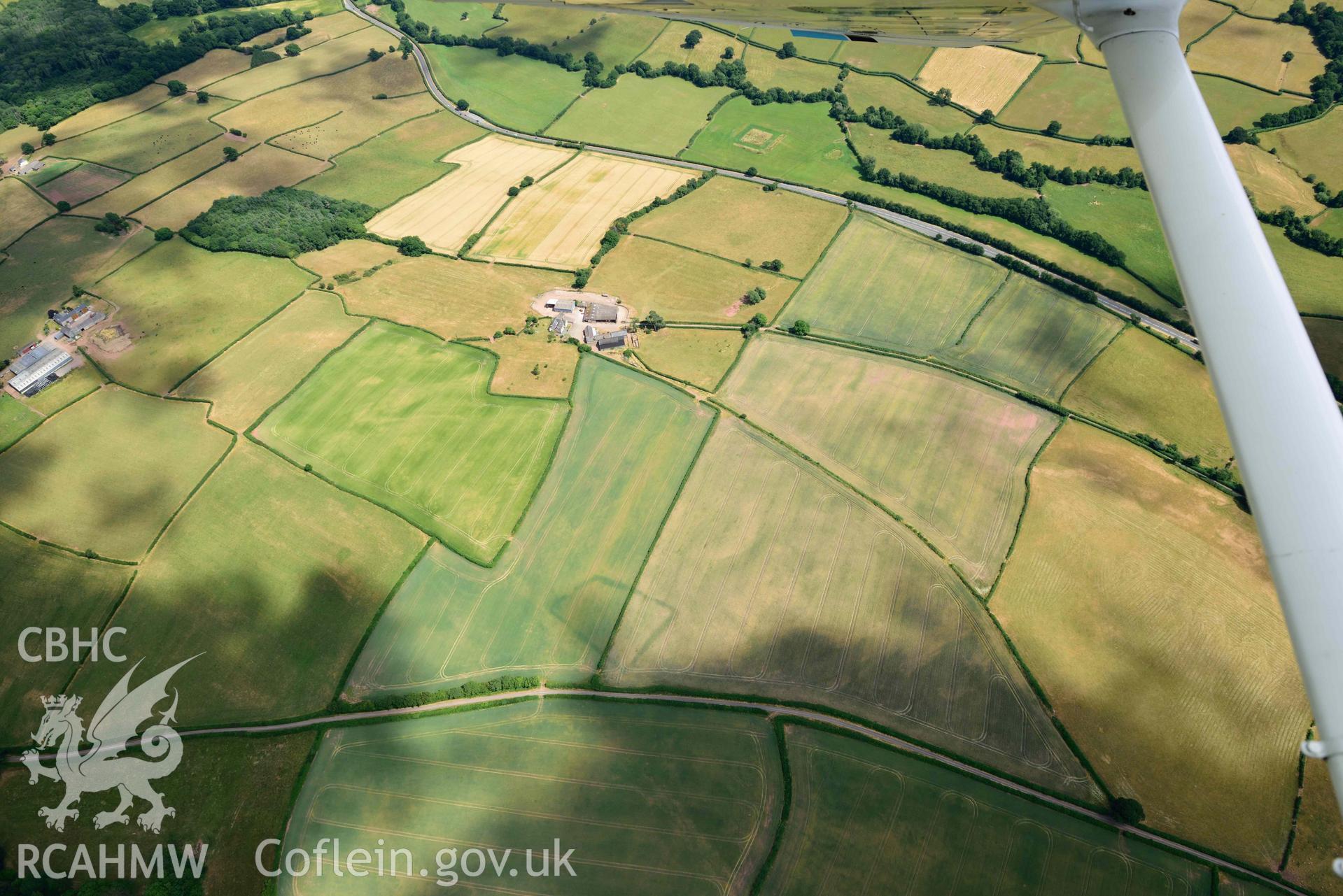 RCAHMW colour oblique aerial photograph of Court Llacca cropmark taken on 9 July 2018 by Toby Driver