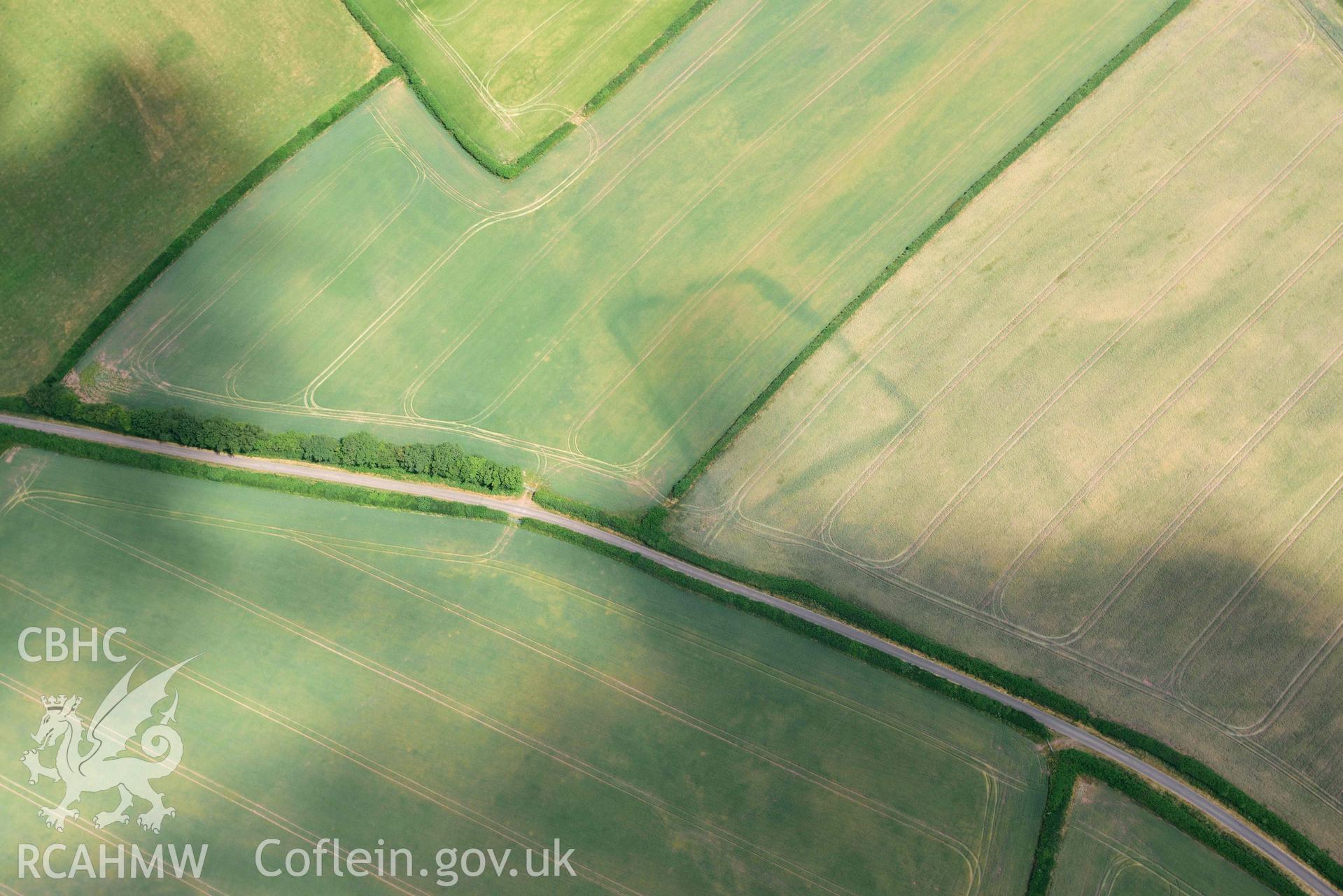 RCAHMW colour oblique aerial photograph of Court Llacca cropmark taken on 9 July 2018 by Toby Driver