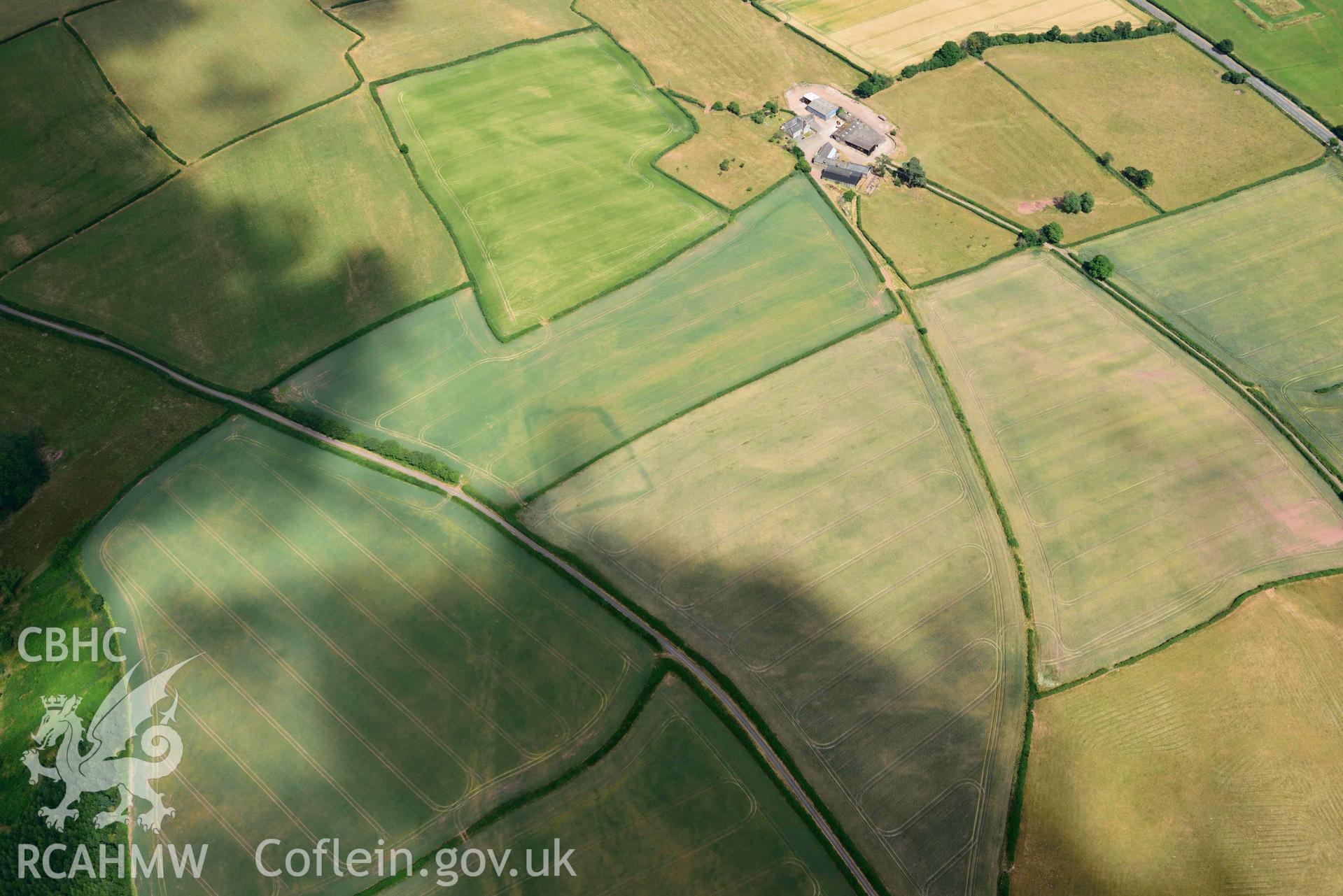 RCAHMW colour oblique aerial photograph of Court Llacca cropmark taken on 9 July 2018 by Toby Driver