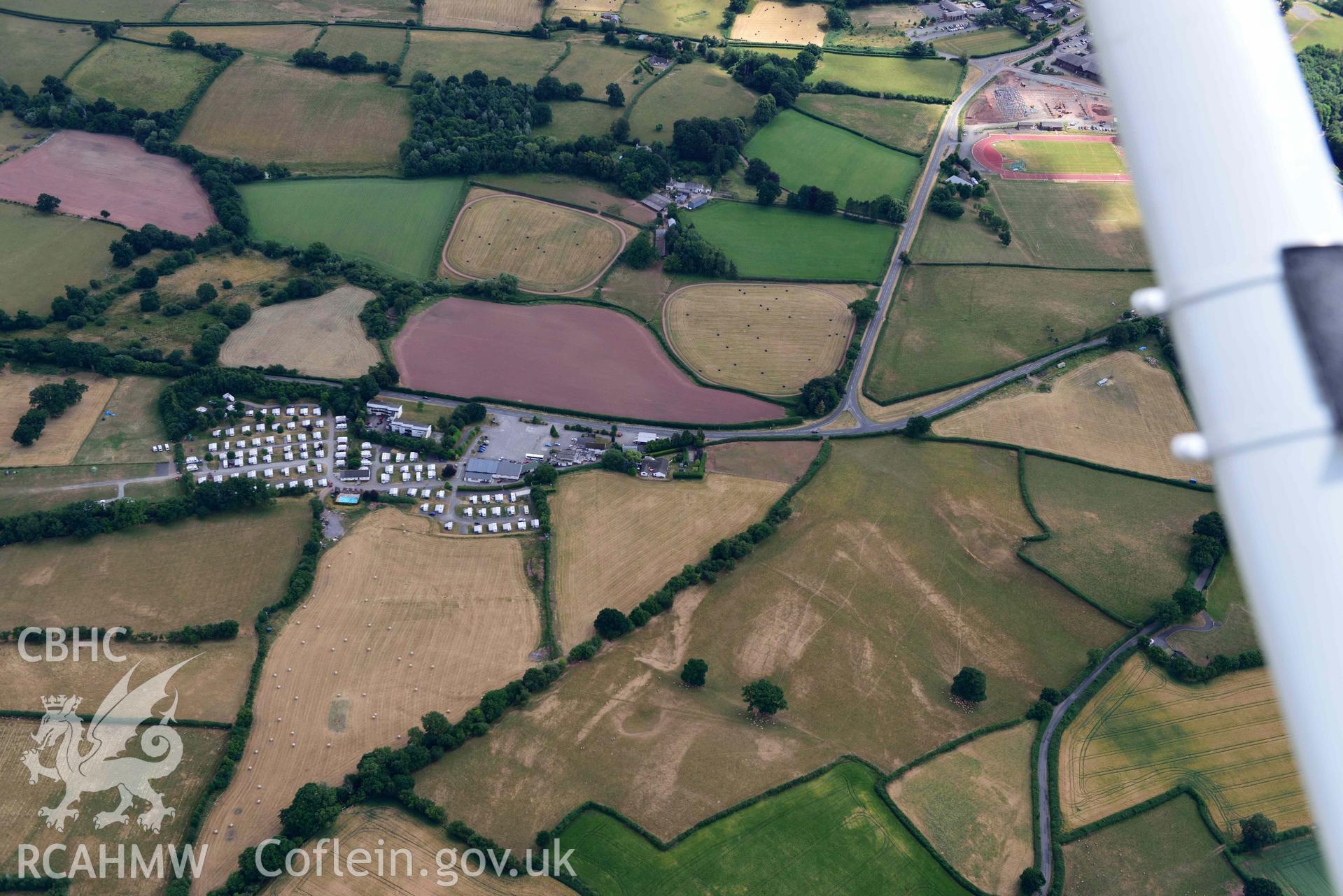 RCAHMW colour oblique aerial photograph of Bishops Meadow cropmarks taken on 9 July 2018 by Toby Driver