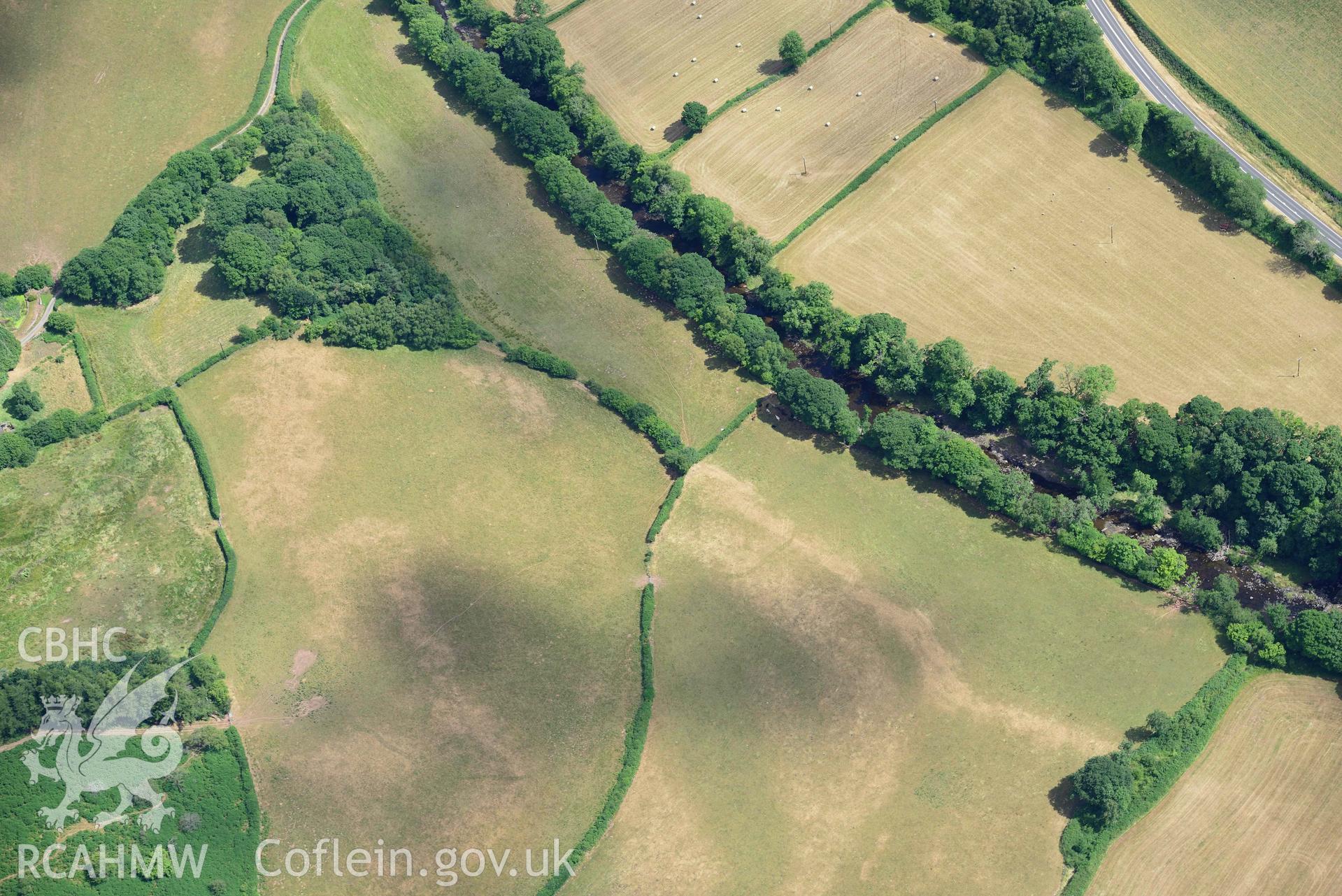 RCAHMW colour oblique aerial photograph of Pont y commin cropmark enclosure taken on 9 July 2018 by Toby Driver