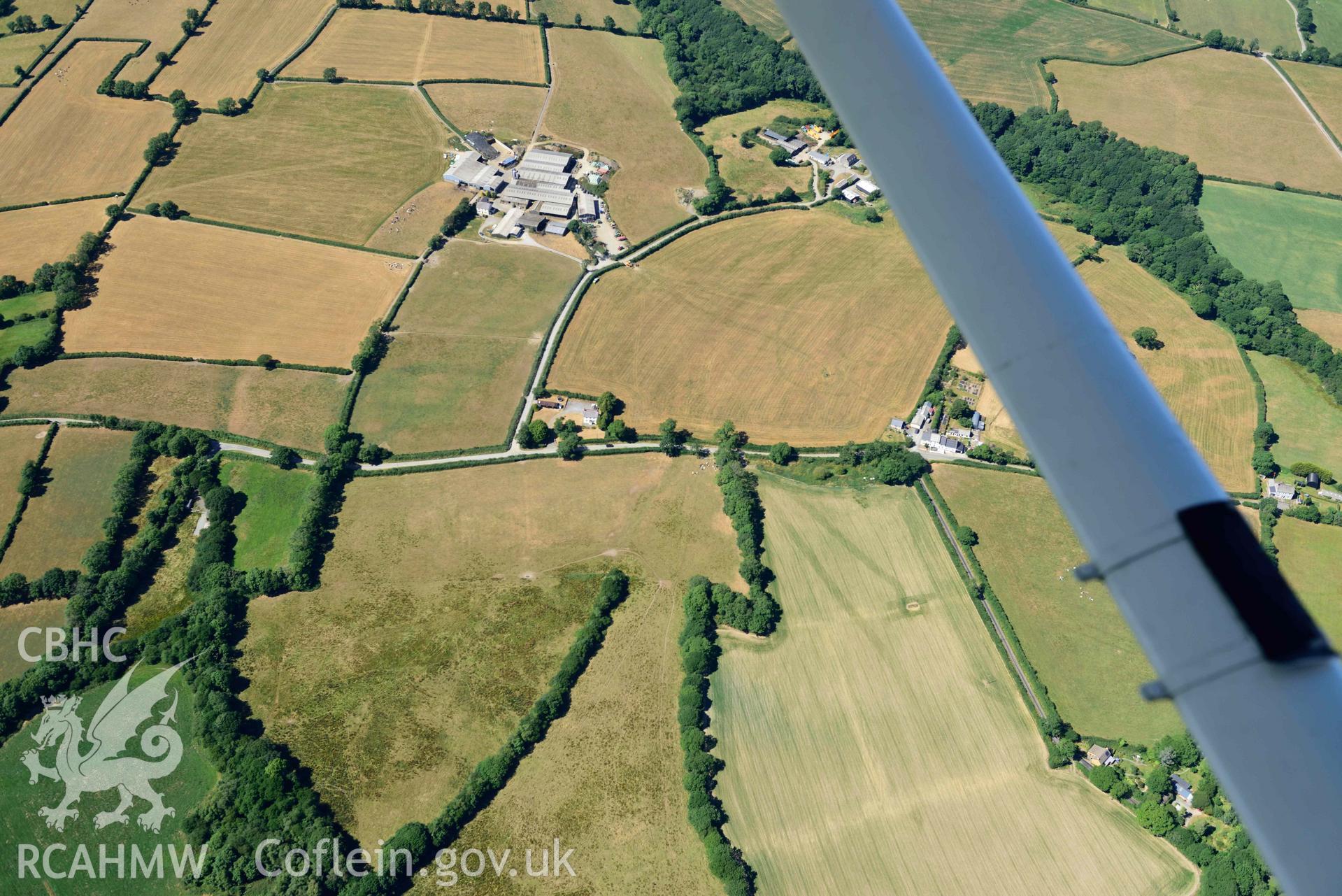 RCAHMW colour oblique aerial photograph of Plas y Parc cropmark enclosure taken on 9 July 2018 by Toby Driver