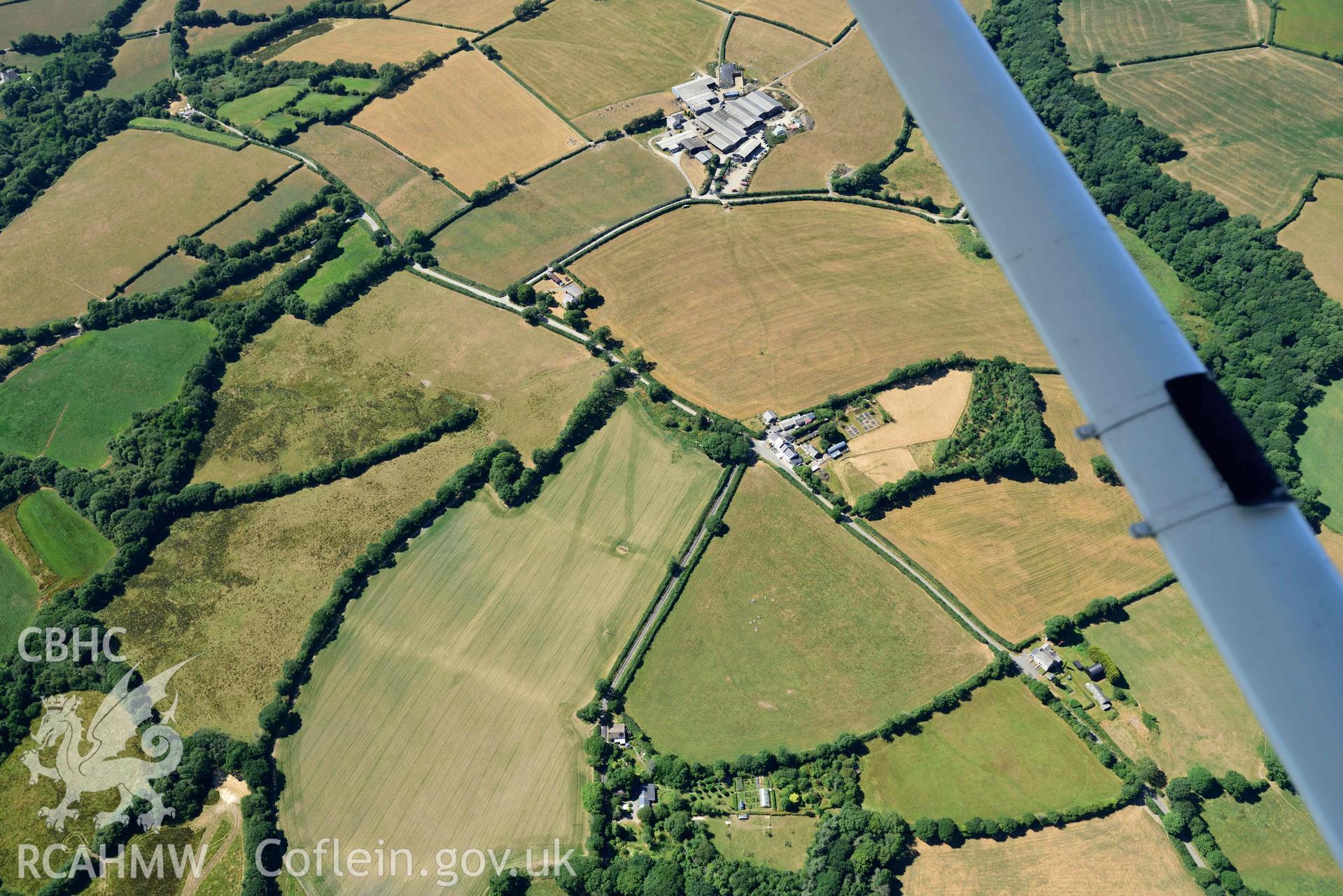 RCAHMW colour oblique aerial photograph of Plas y Parc cropmark enclosure taken on 9 July 2018 by Toby Driver