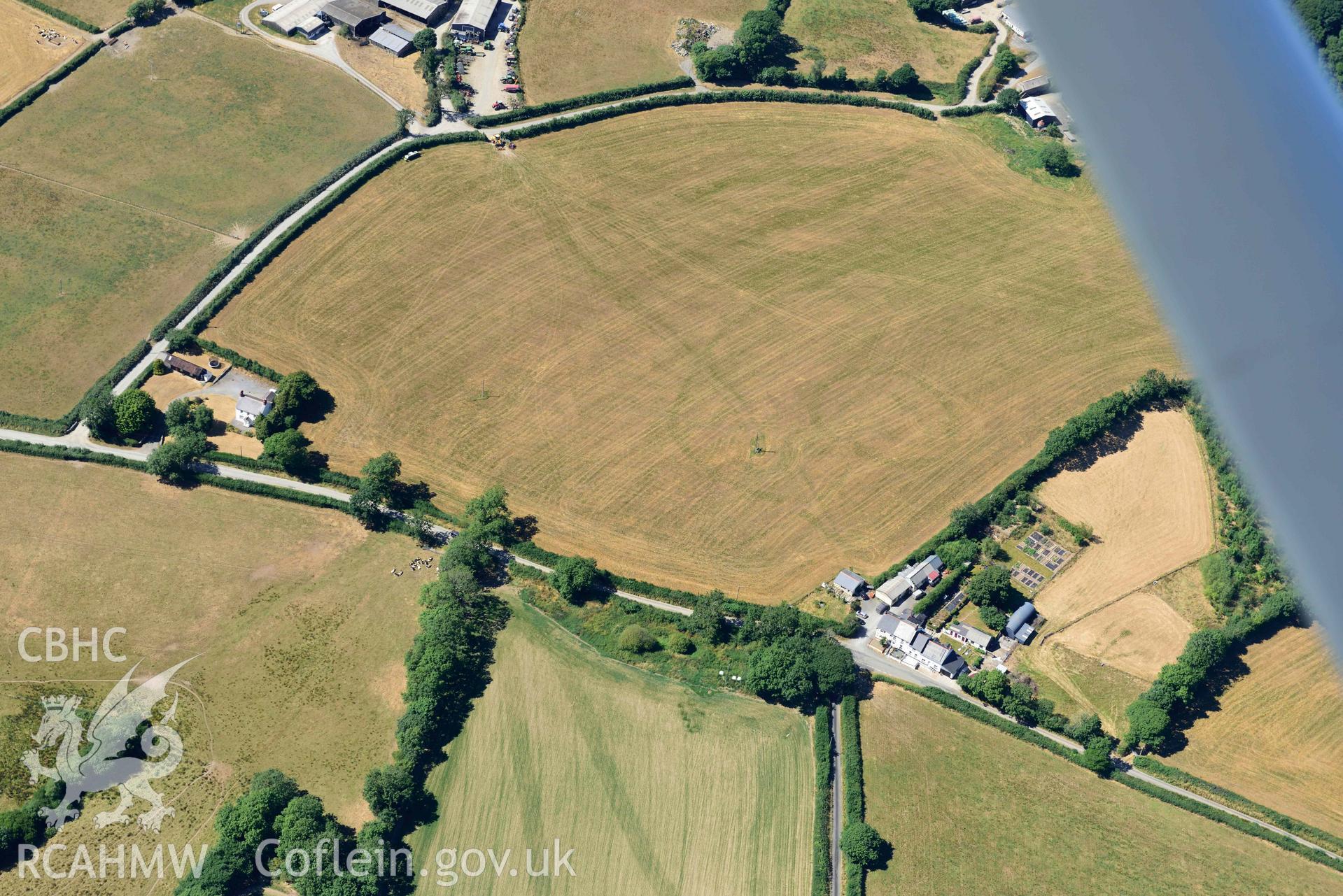 RCAHMW colour oblique aerial photograph of Plas y Parc cropmark enclosure taken on 9 July 2018 by Toby Driver