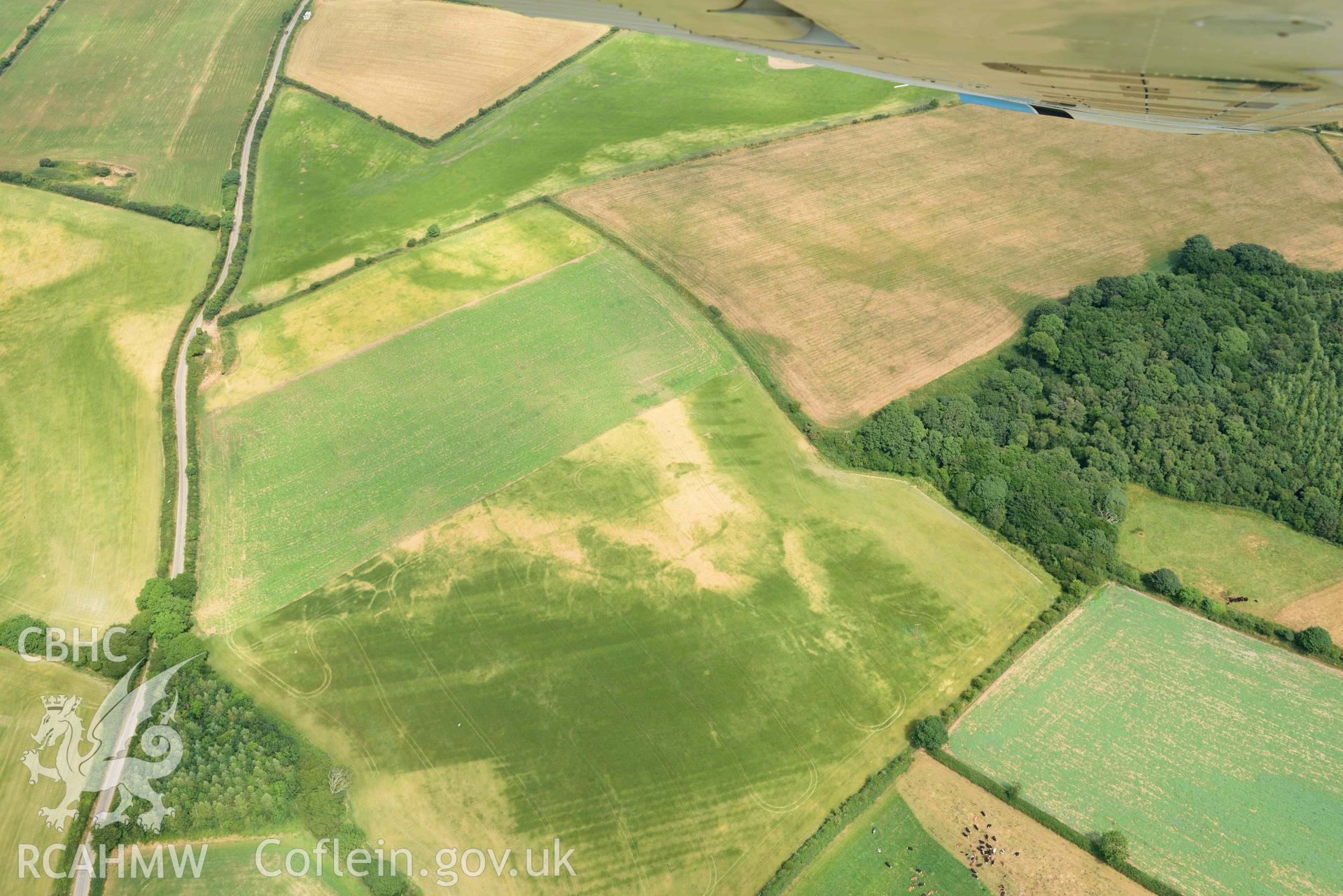 RCAHMW colour oblique aerial photograph of Causewayed enclosure, Dryslwyn taken on 11 July 2018 by Toby Driver