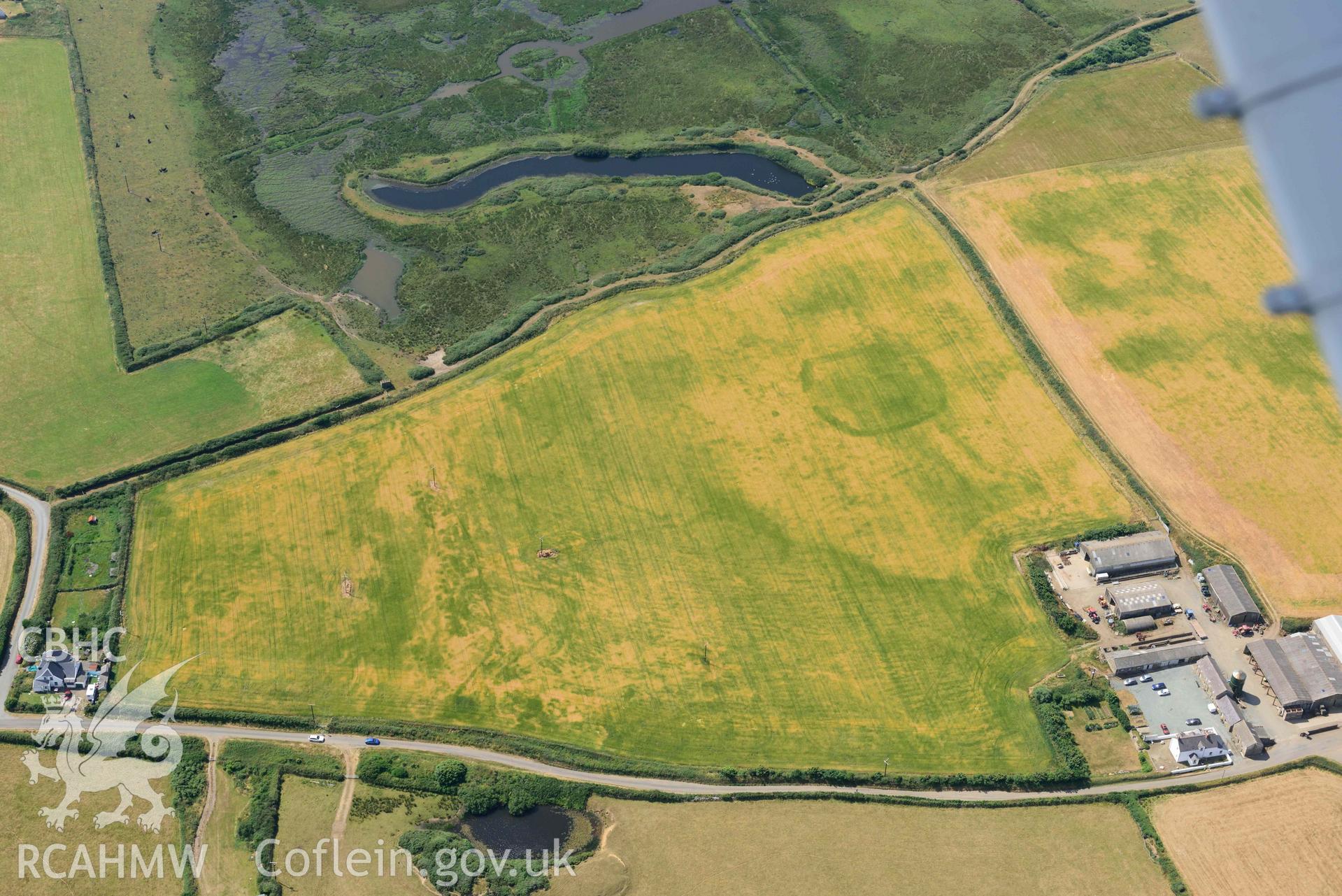 Aerial photography of Trehill Farm defended enclosure, Marloes Aerial reconnaissance survey for the CHERISH Project. Crown Copyright: CHERISH PROJECT 2018. Produced with EU funds through the Ireland Wales Co-operation Programme 2014-2020. All material made freely available through the Open Government Licence.