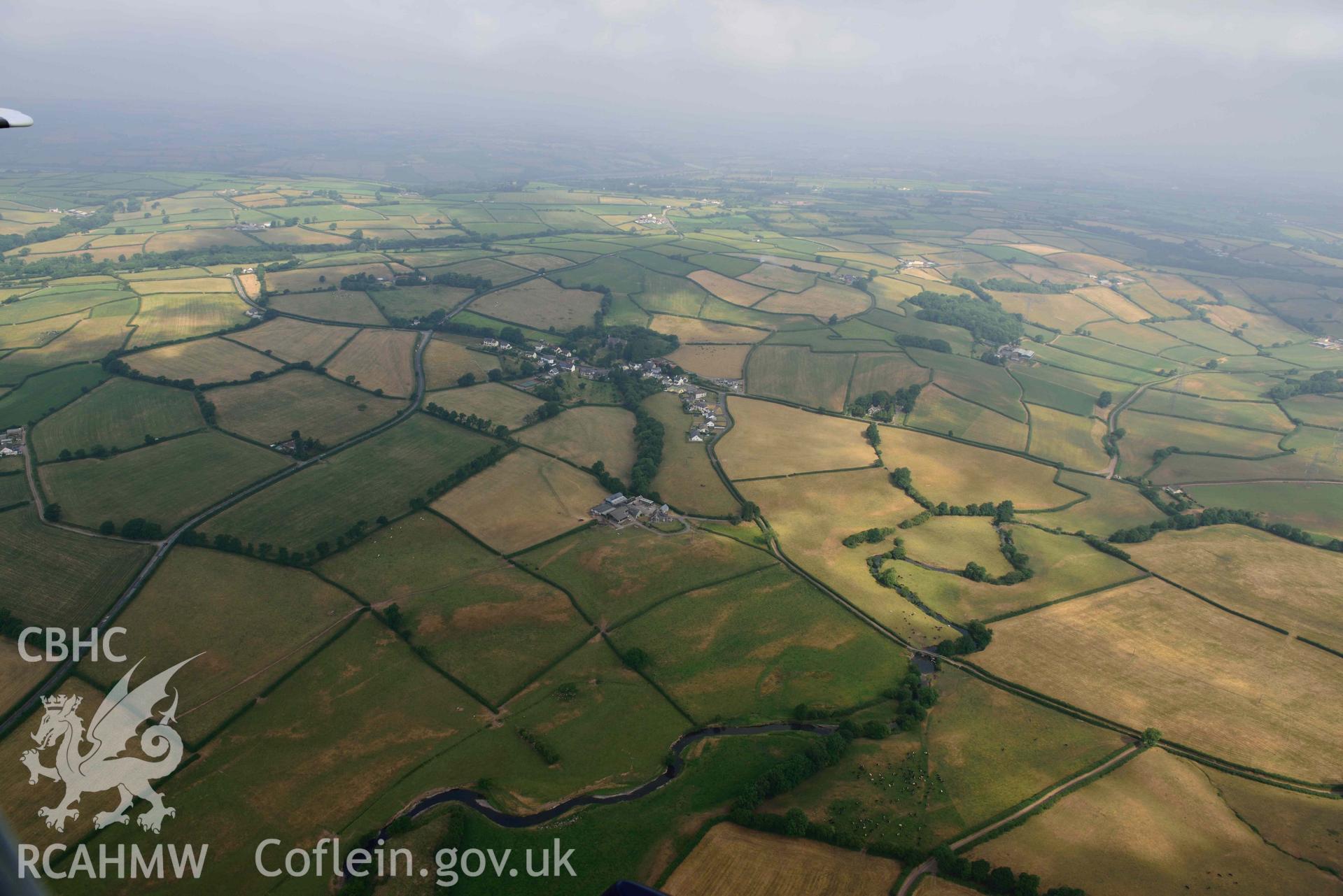 Aerial photography of Llandyfaelog village and Roman road, south of Nantllan Aerial reconnaissance survey for the CHERISH Project. Crown Copyright: CHERISH PROJECT 2018. Produced with EU funds through the Ireland Wales Co-operation Programme 2014-2020. All material made freely available through the Open Government Licence.