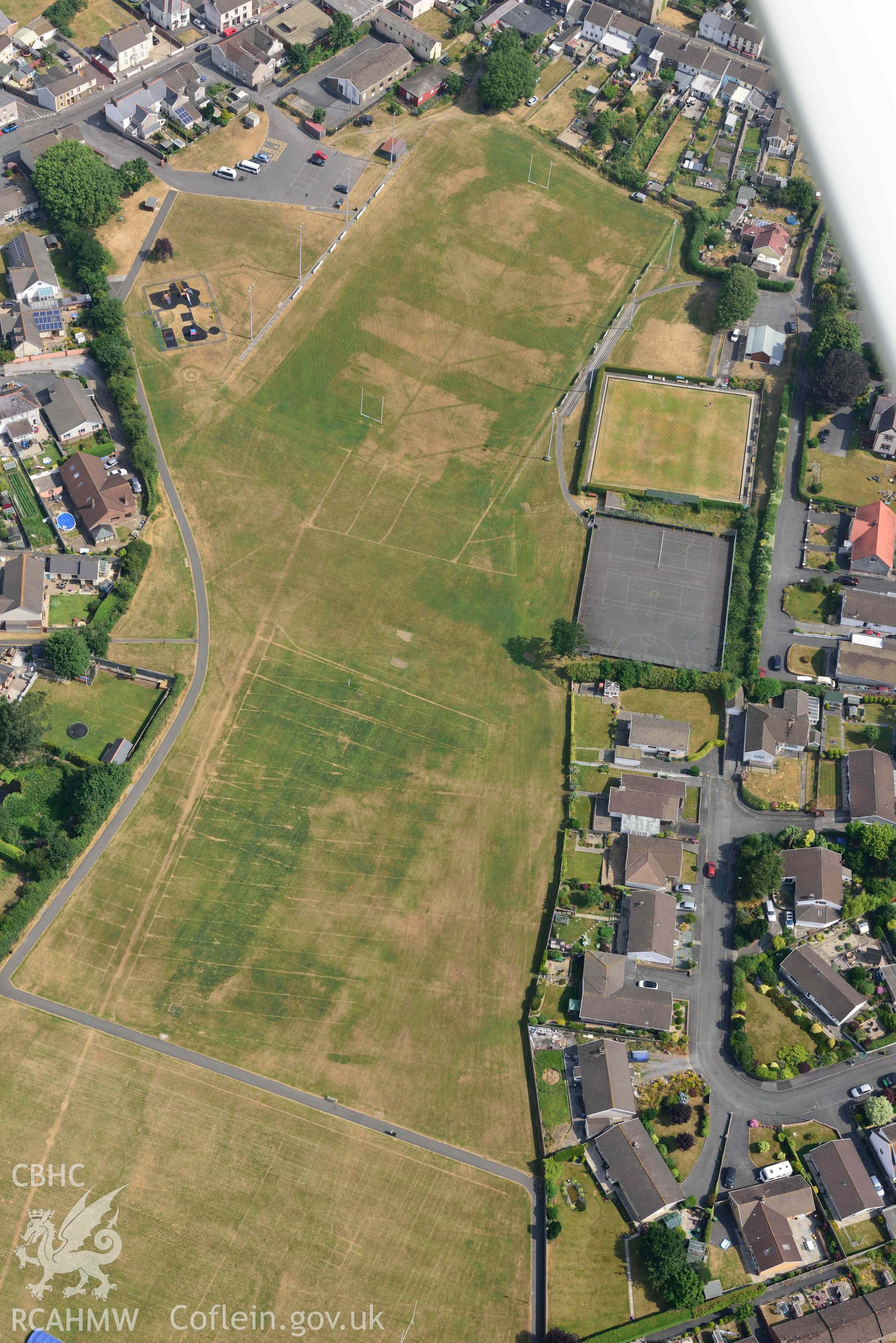 Aerial photography of Kidwell Town & borough with parchmarks in grassland Aerial reconnaissance survey for the CHERISH Project. Crown Copyright: CHERISH PROJECT 2018. Produced with EU funds through the Ireland Wales Co-operation Programme 2014-2020. All material made freely available through the Open Government Licence.