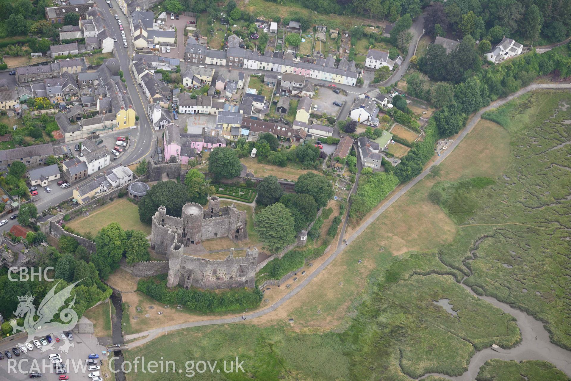 Aerial photography of Laugharne castle and harbour Aerial reconnaissance survey for the CHERISH Project. Crown Copyright: CHERISH PROJECT 2018. Produced with EU funds through the Ireland Wales Co-operation Programme 2014-2020. All material made freely available through the Open Government Licence.