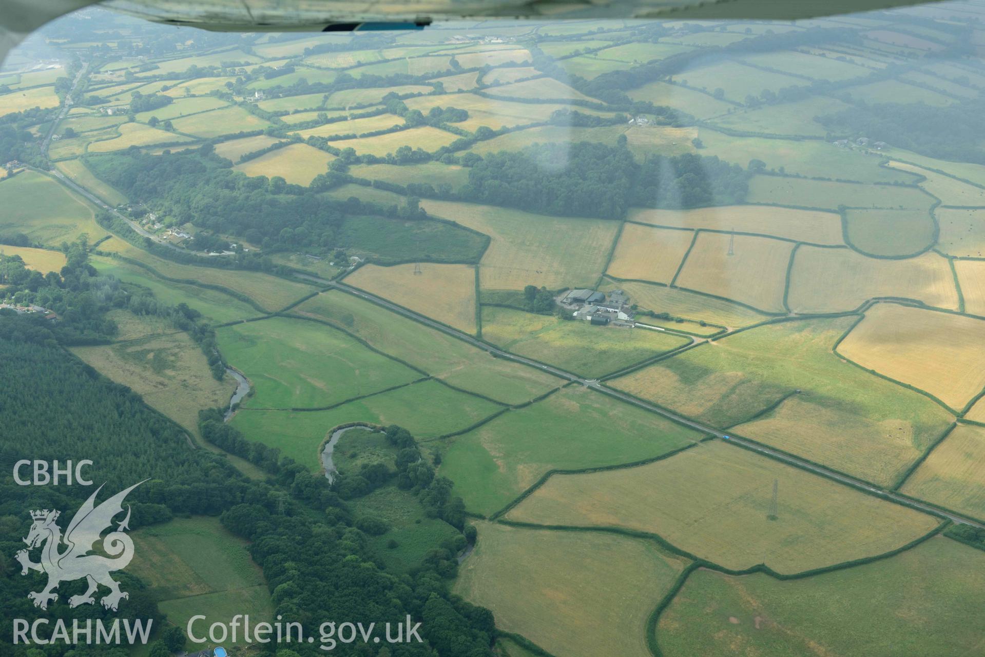 Aerial photography of Roman Road, 60 Carmarthan to Kidwelly at Pontmorlais cottage Aerial reconnaissance survey for the CHERISH Project. Crown Copyright: CHERISH PROJECT 2018. Produced with EU funds through the Ireland Wales Co-operation Programme 2014-2020. All material made freely available through the Open Government Licence.