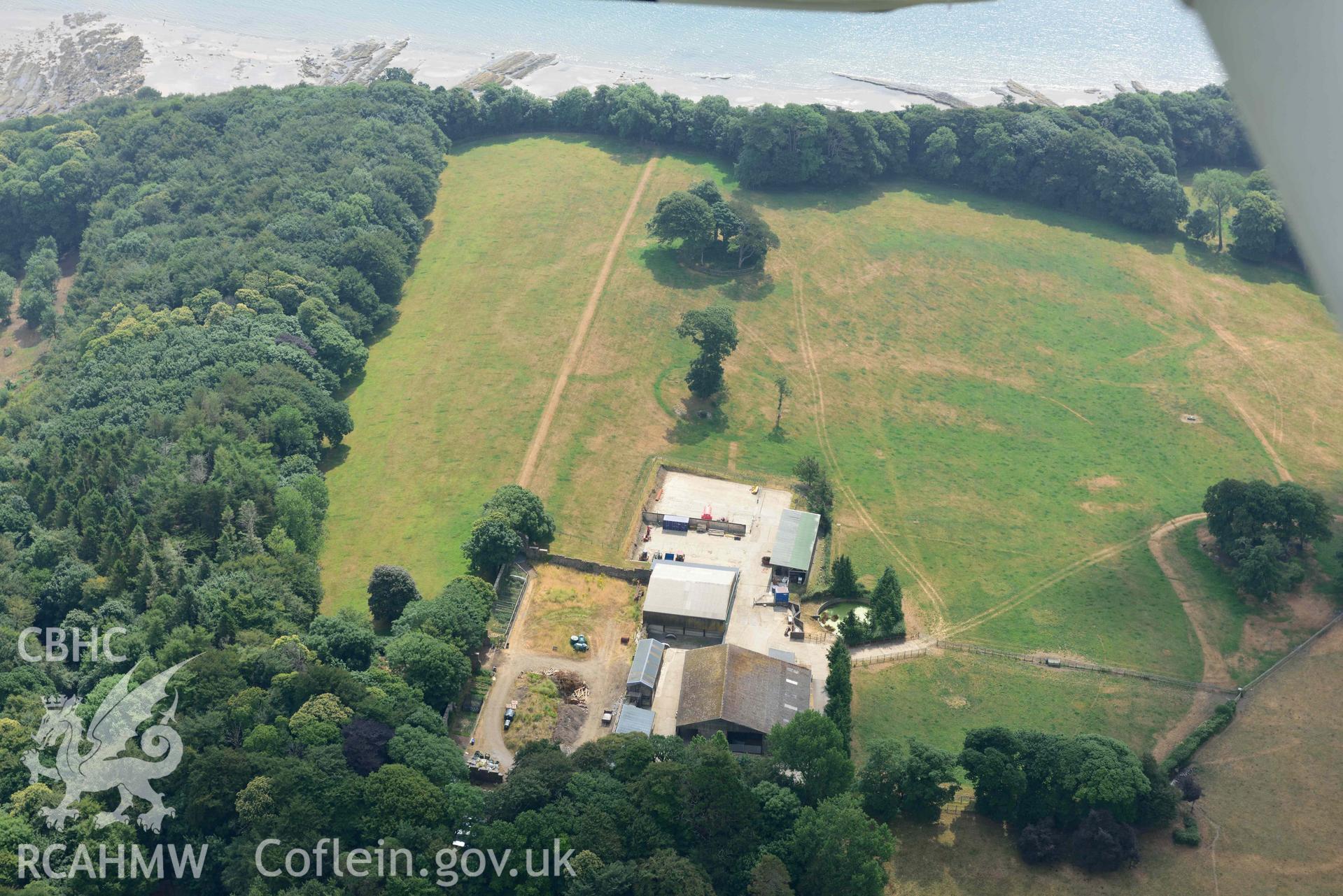 Aerial photography of Hean Castle defended enclosure Aerial reconnaissance survey for the CHERISH Project. Crown Copyright: CHERISH PROJECT 2018. Produced with EU funds through the Ireland Wales Co-operation Programme 2014-2020. All material made freely available through the Open Government Licence.