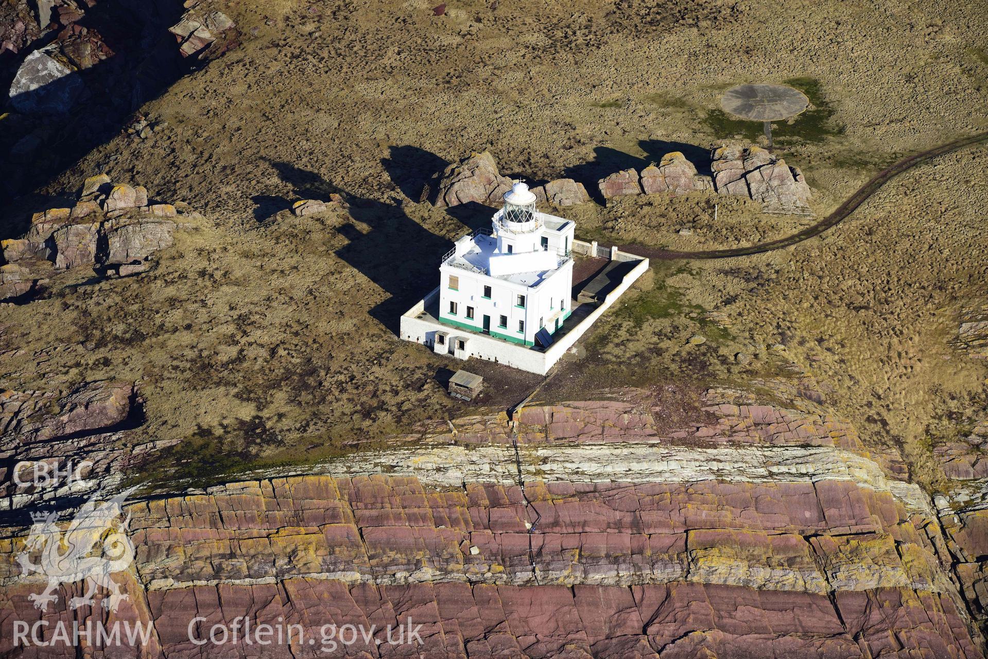 Aerial photo of Skokholm lighthouse.  Aerial reconnaissance survey for the CHERISH Project. Crown Copyright: CHERISH PROJECT 2018. Produced with EU funds through the Ireland Wales Co-operation Programme 2014-2020. All material made freely available through the Open Government Licence.