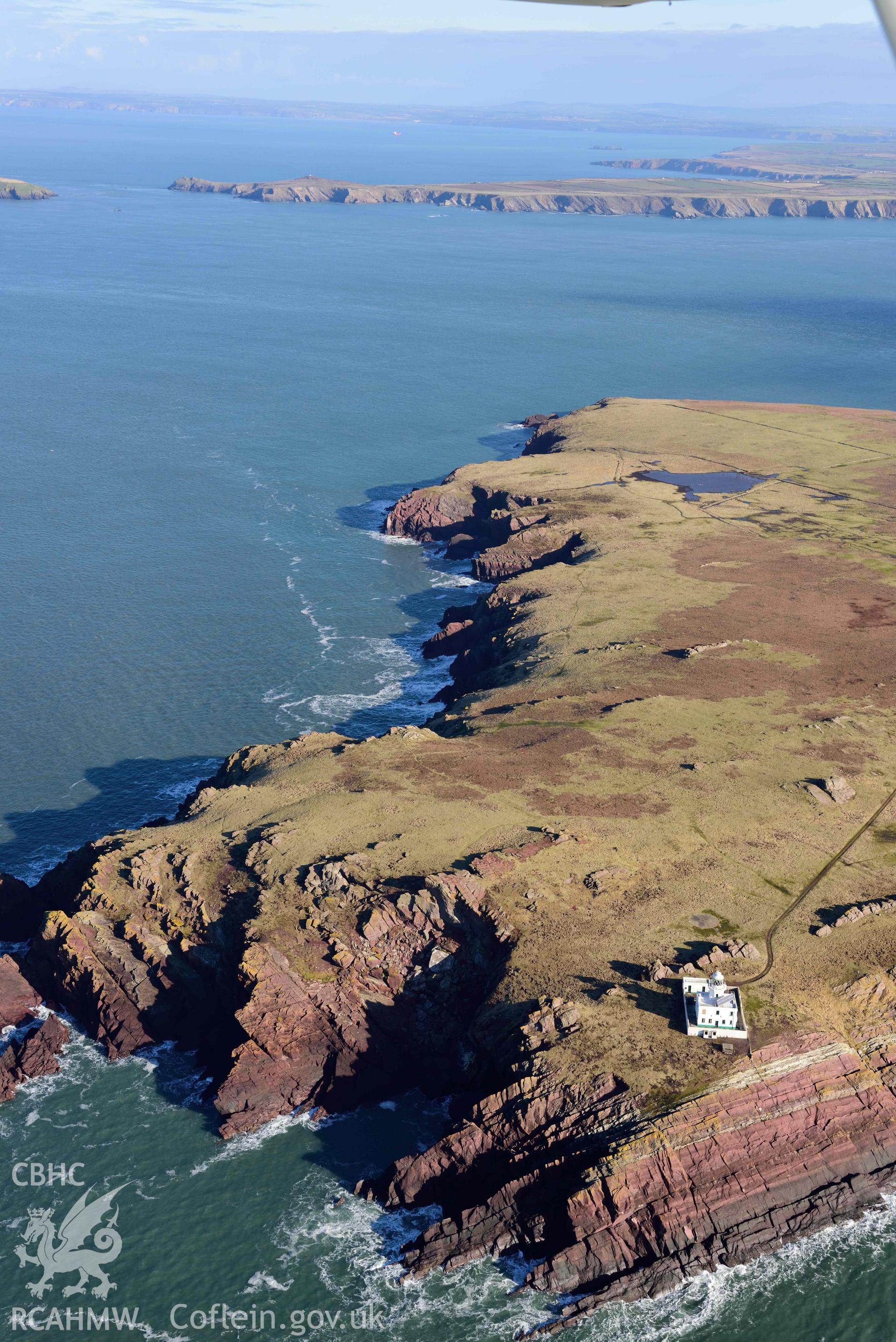 Aerial photo of Skokholm lighthouse.  Aerial reconnaissance survey for the CHERISH Project. Crown Copyright: CHERISH PROJECT 2018. Produced with EU funds through the Ireland Wales Co-operation Programme 2014-2020. All material made freely available through the Open Government Licence.