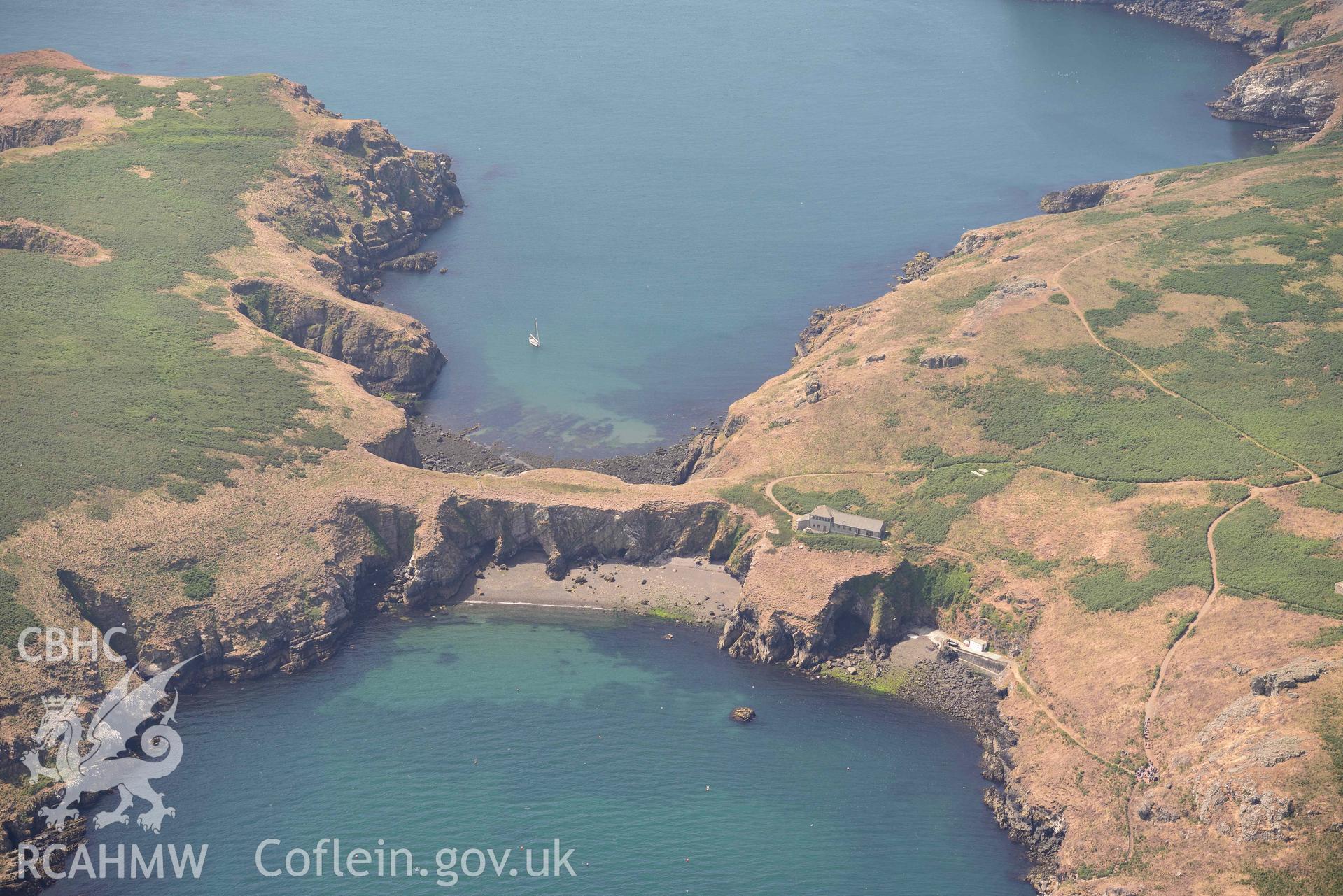 Aerial photography of Skomer Island: Warden's House and Neck Isthmus Aerial reconnaissance survey for the CHERISH Project. Crown Copyright: CHERISH PROJECT 2018. Produced with EU funds through the Ireland Wales Co-operation Programme 2014-2020. All material made freely available through the Open Government Licence.