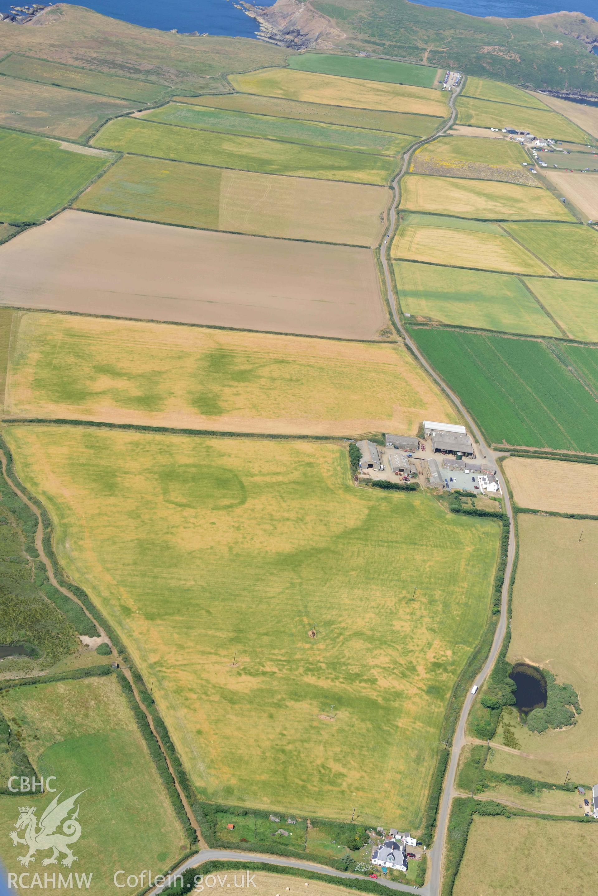 Aerial photography of Trehill Farm defended enclosure, Marloes Aerial reconnaissance survey for the CHERISH Project. Crown Copyright: CHERISH PROJECT 2018. Produced with EU funds through the Ireland Wales Co-operation Programme 2014-2020. All material made freely available through the Open Government Licence.